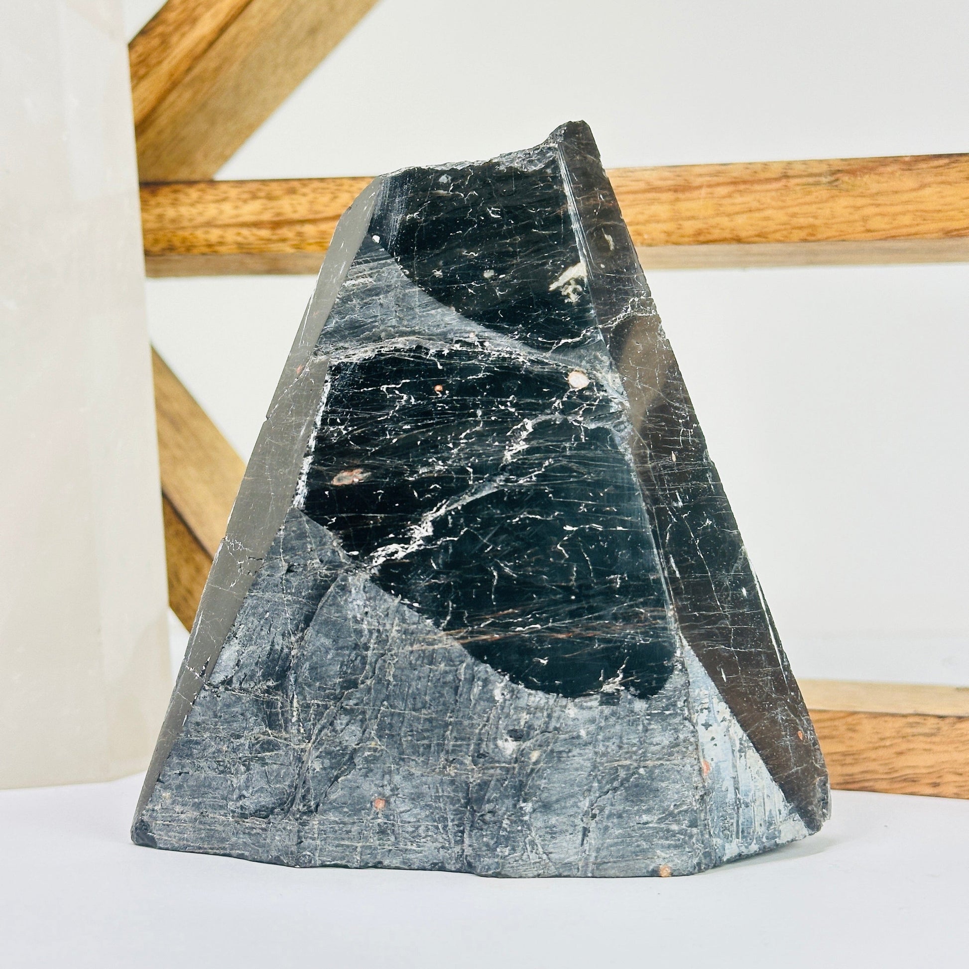 tourmaline point with decorations in the background