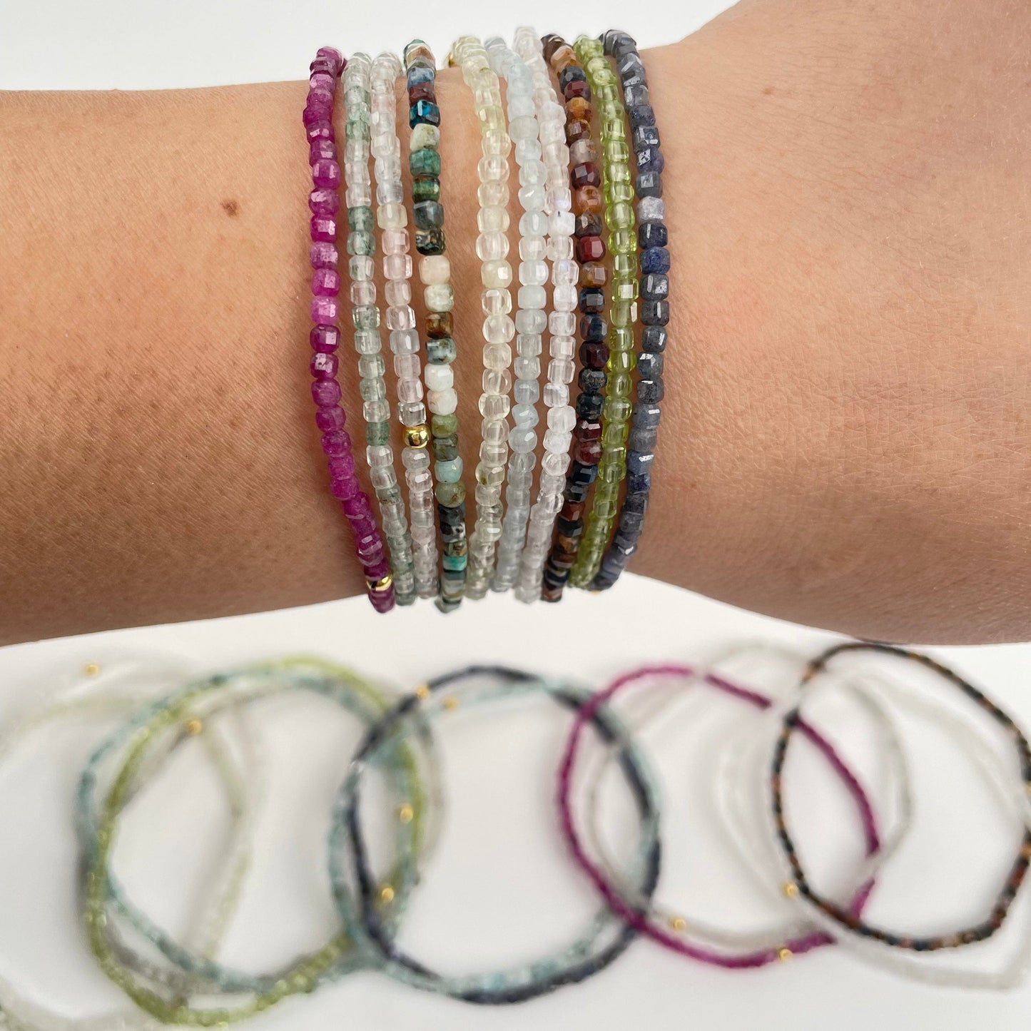 mini cube bracelets on wrist for size reference 