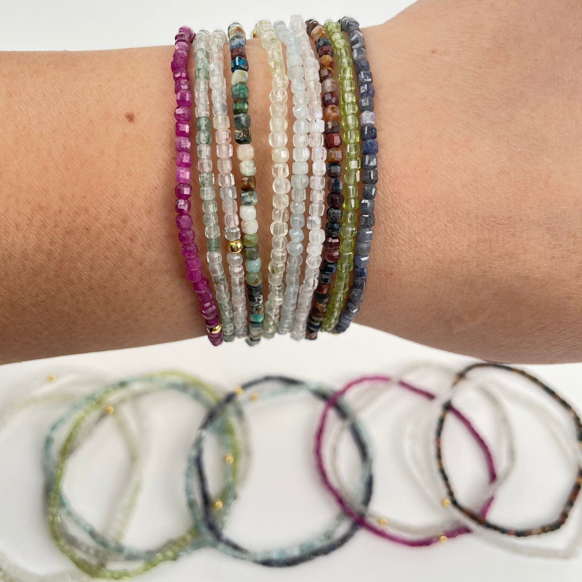 mini cube bracelets on wrist for size reference 
