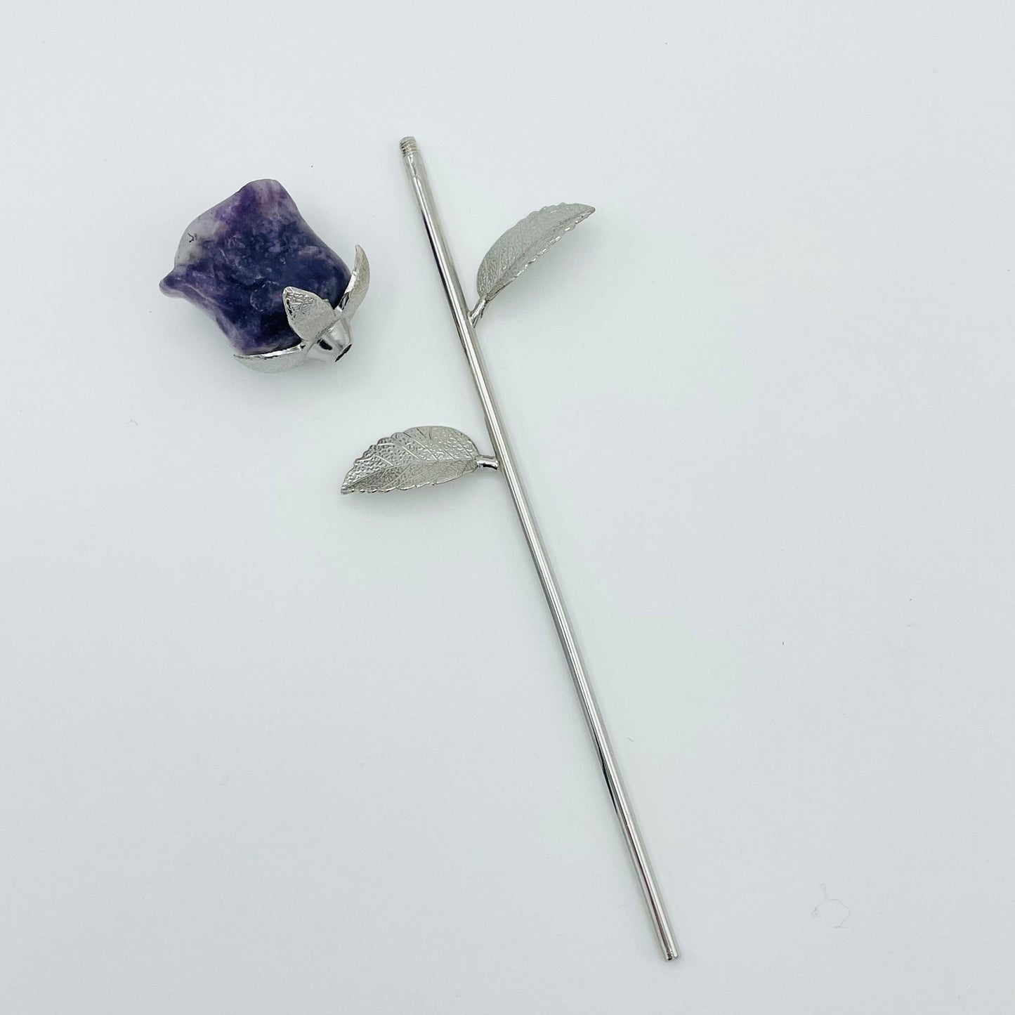 top of the rose screws on to the stem  