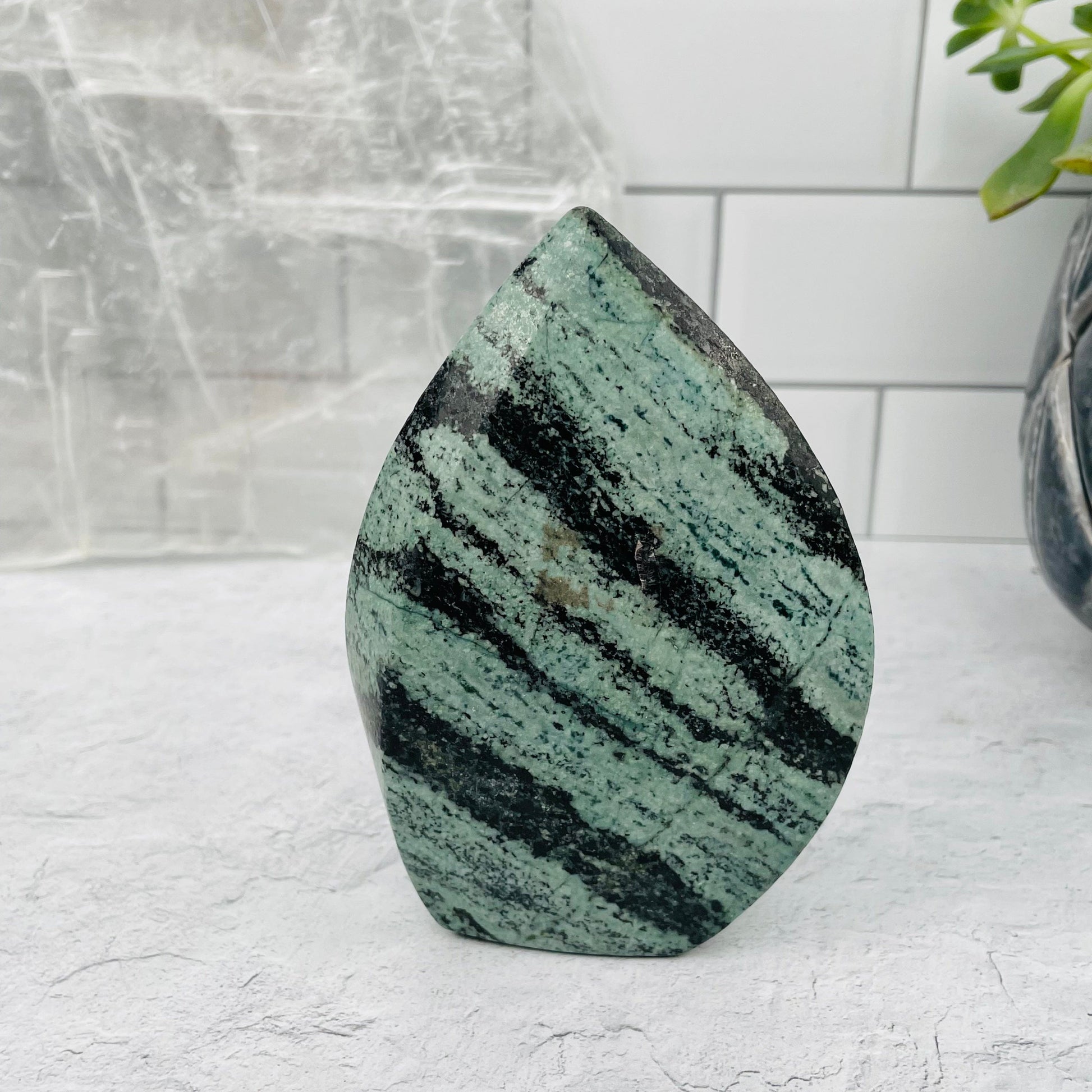 Green Snake Skin Jasper Flame displayed as home decor 