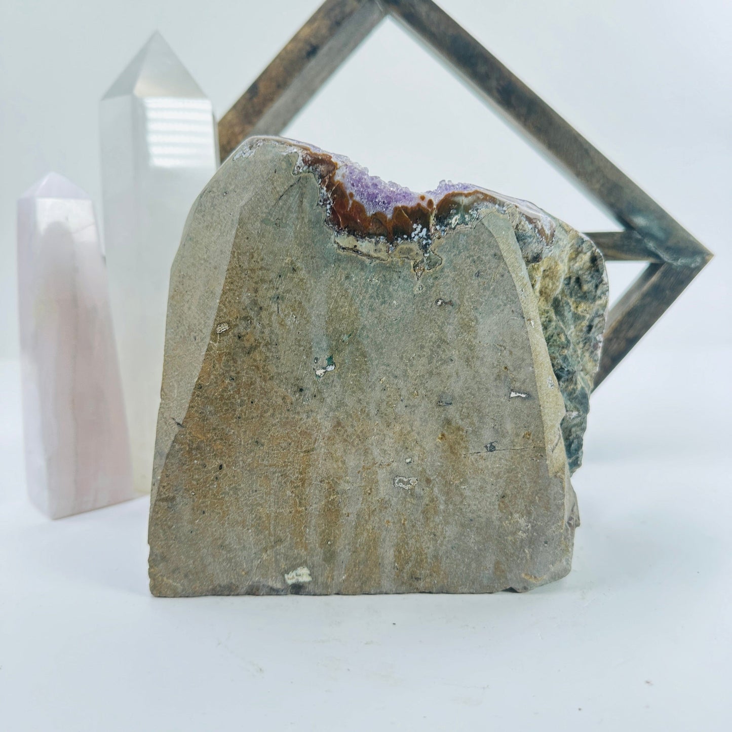 amethyst cut base with decorations in the background