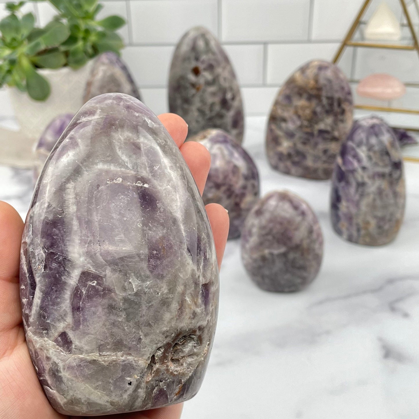 multiple chevron amethyst cut base displayed to show the differences in the sizes and color shades 