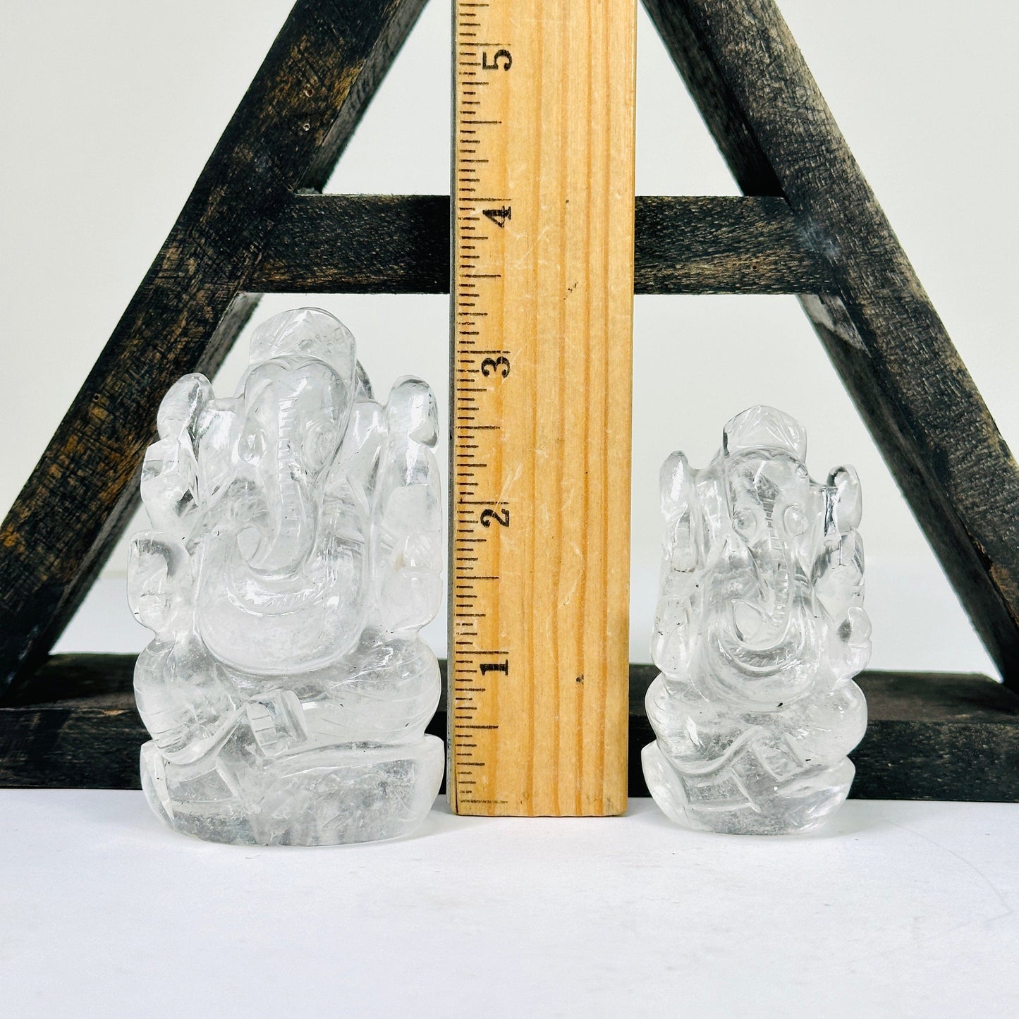 Ganesha Elephant crystal Quartz Carving with a ruler for size reference.