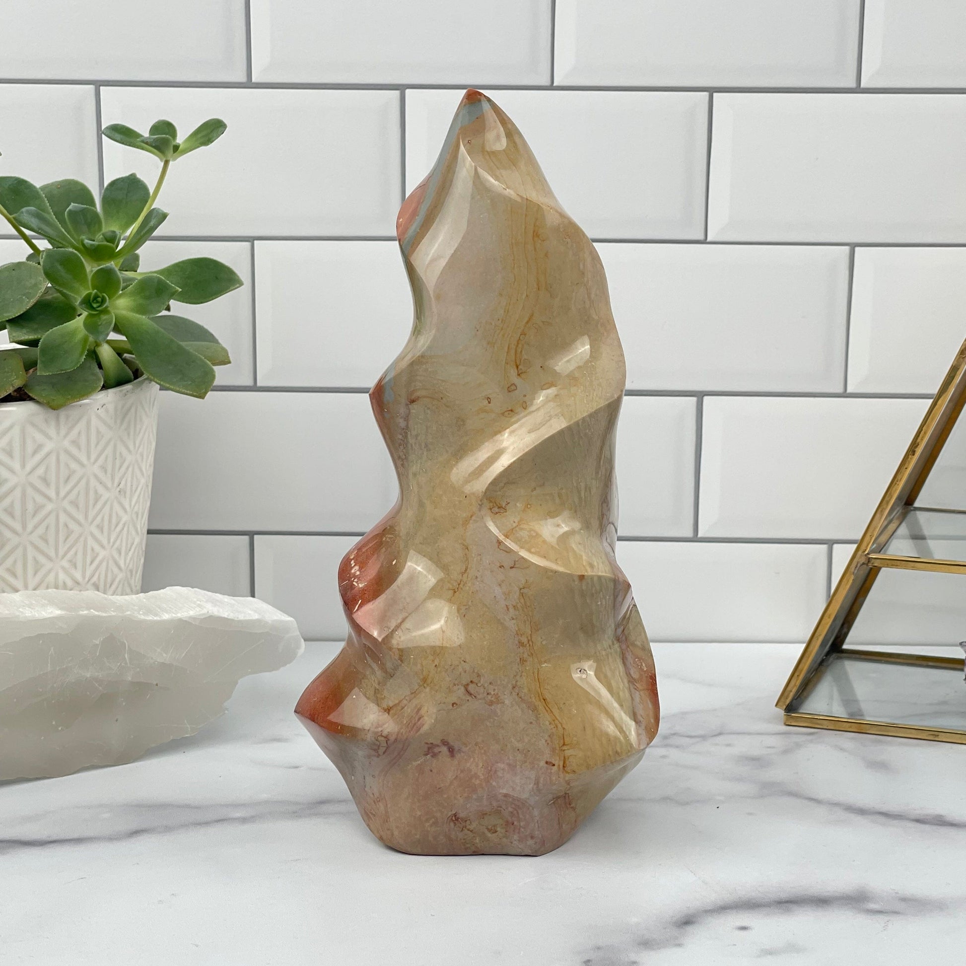 Polychrome Jasper Polished Flame Point displayed as home decor