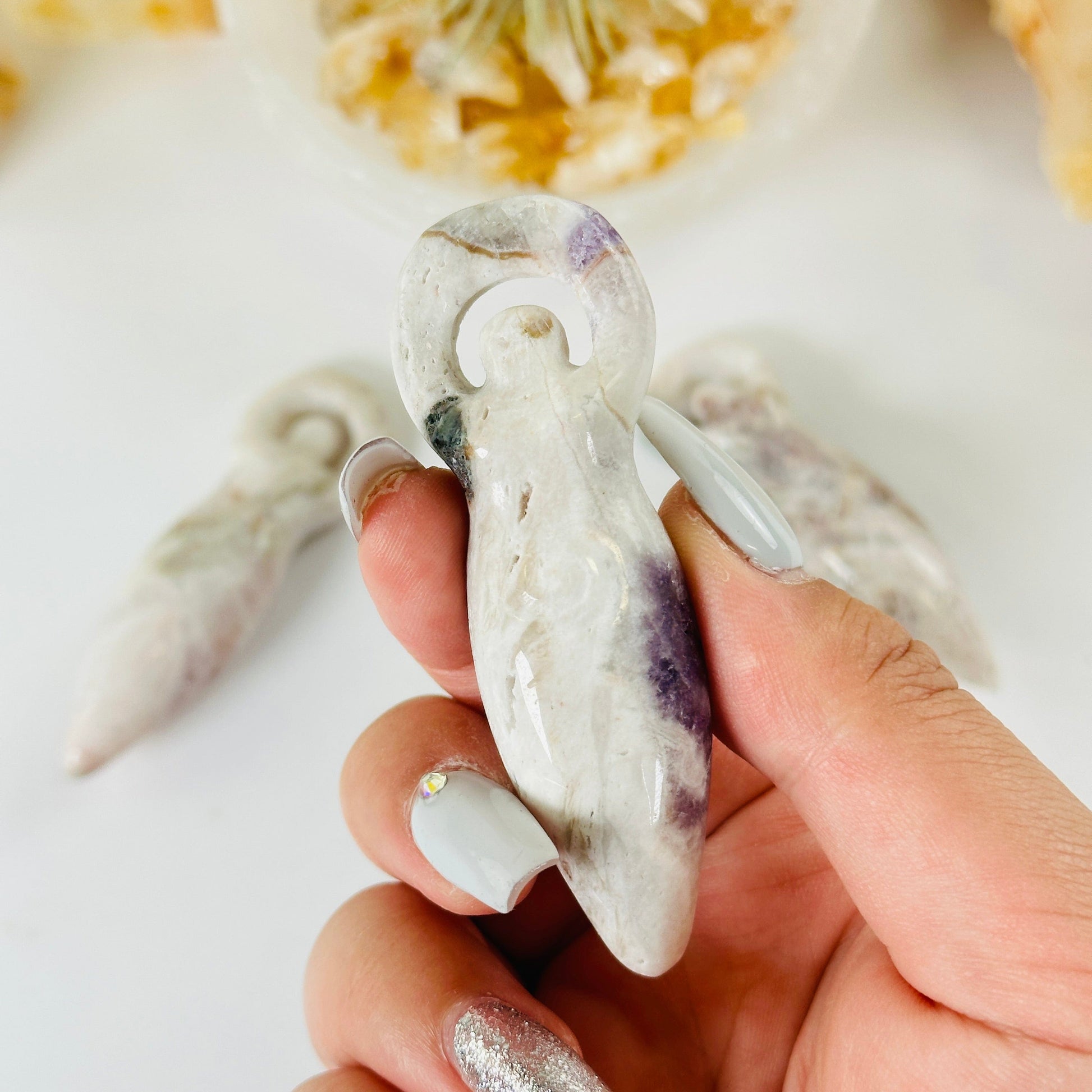 Pink Amethyst Earth Goddess Sculpture - You Choose variant 2 in hand for size reference with other variants in the background