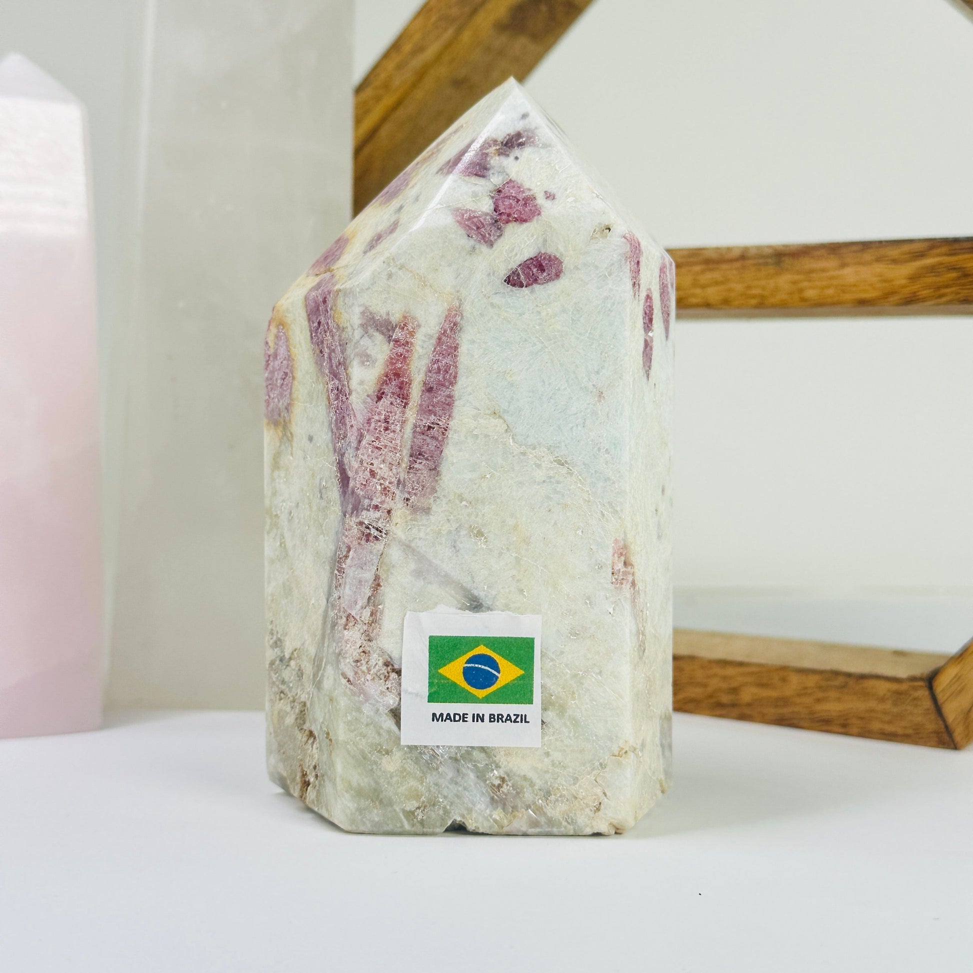 tourmaline point with decorations in the background