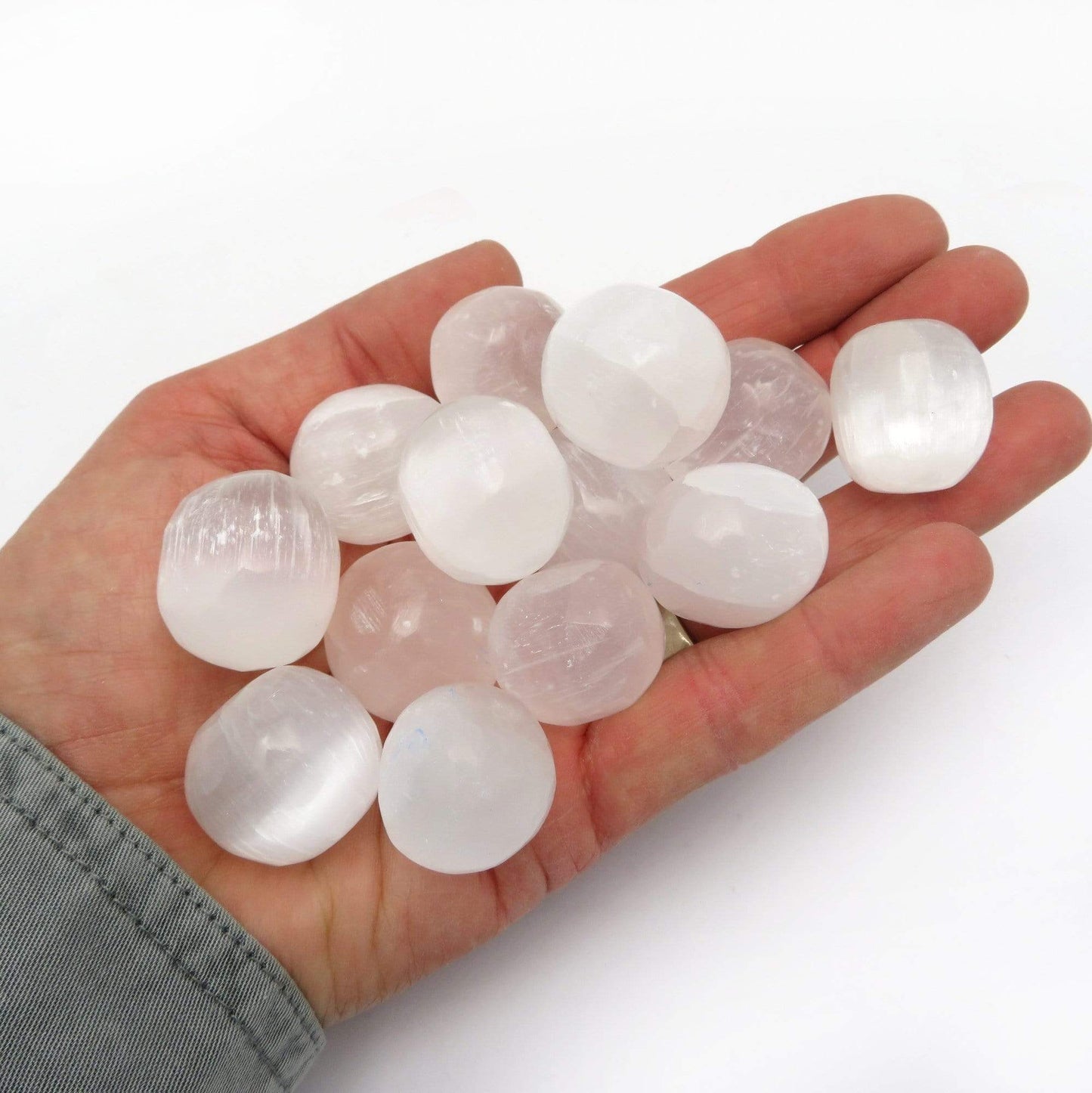 Selenite Tumbled Freeform in a hand for size reference
