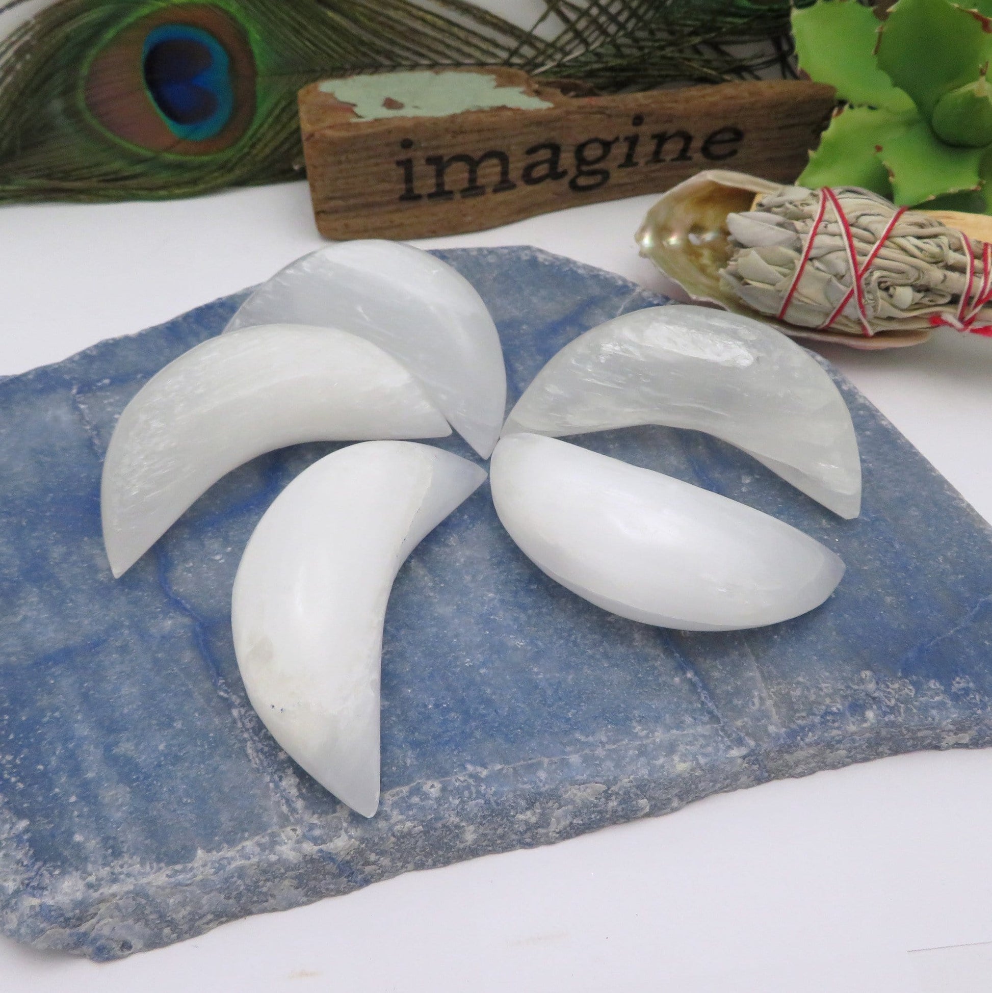 selenite crescent moons on display for possible variations