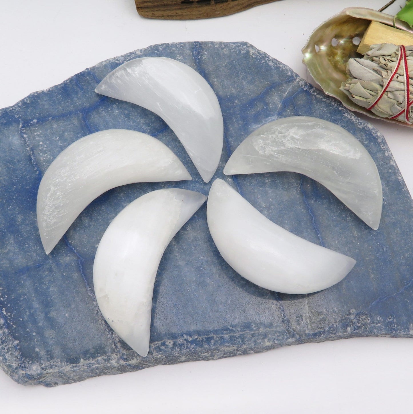 selenite crescent moons on display for possible variations 