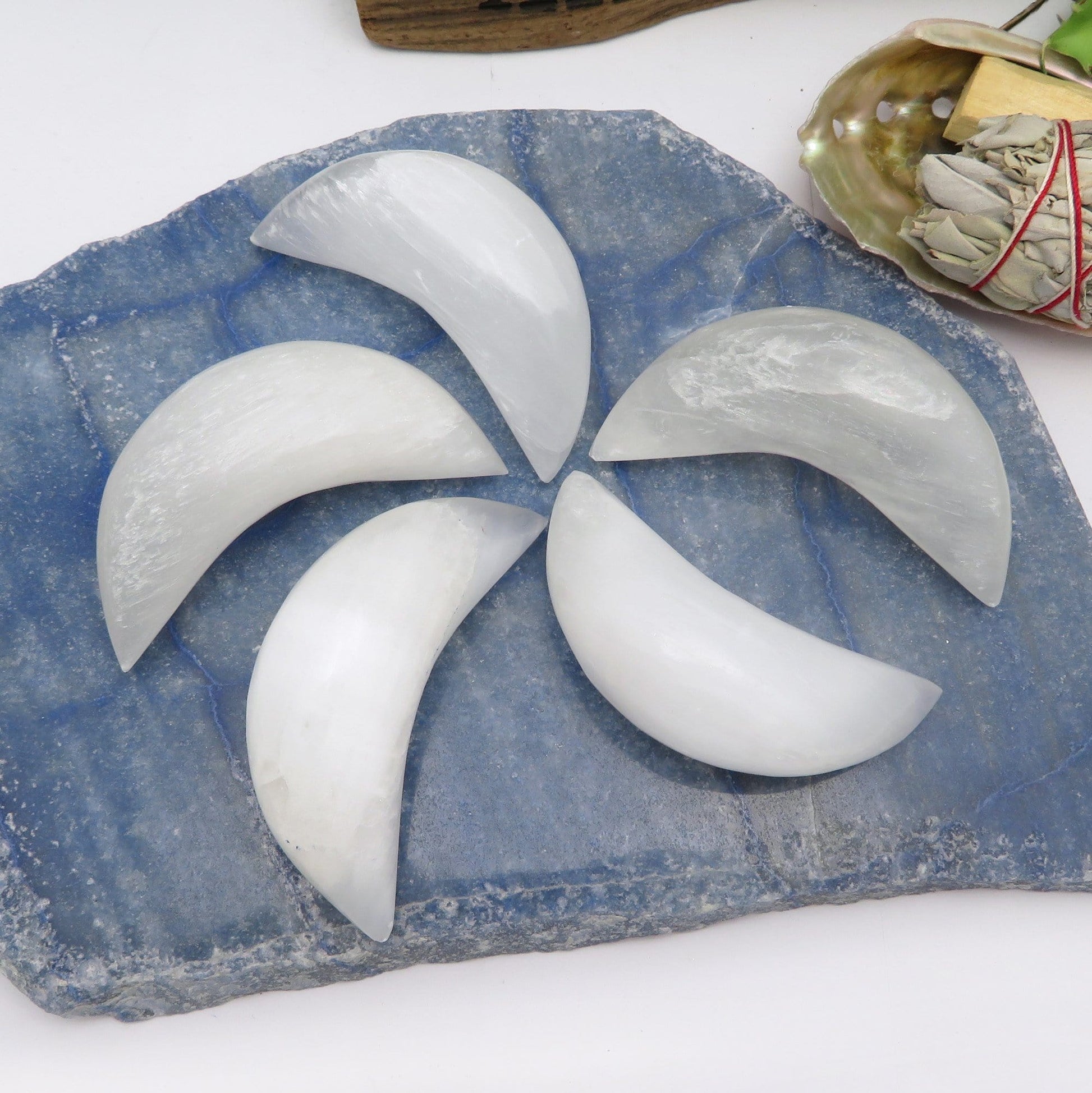 selenite crescent moons on display for possible variations 