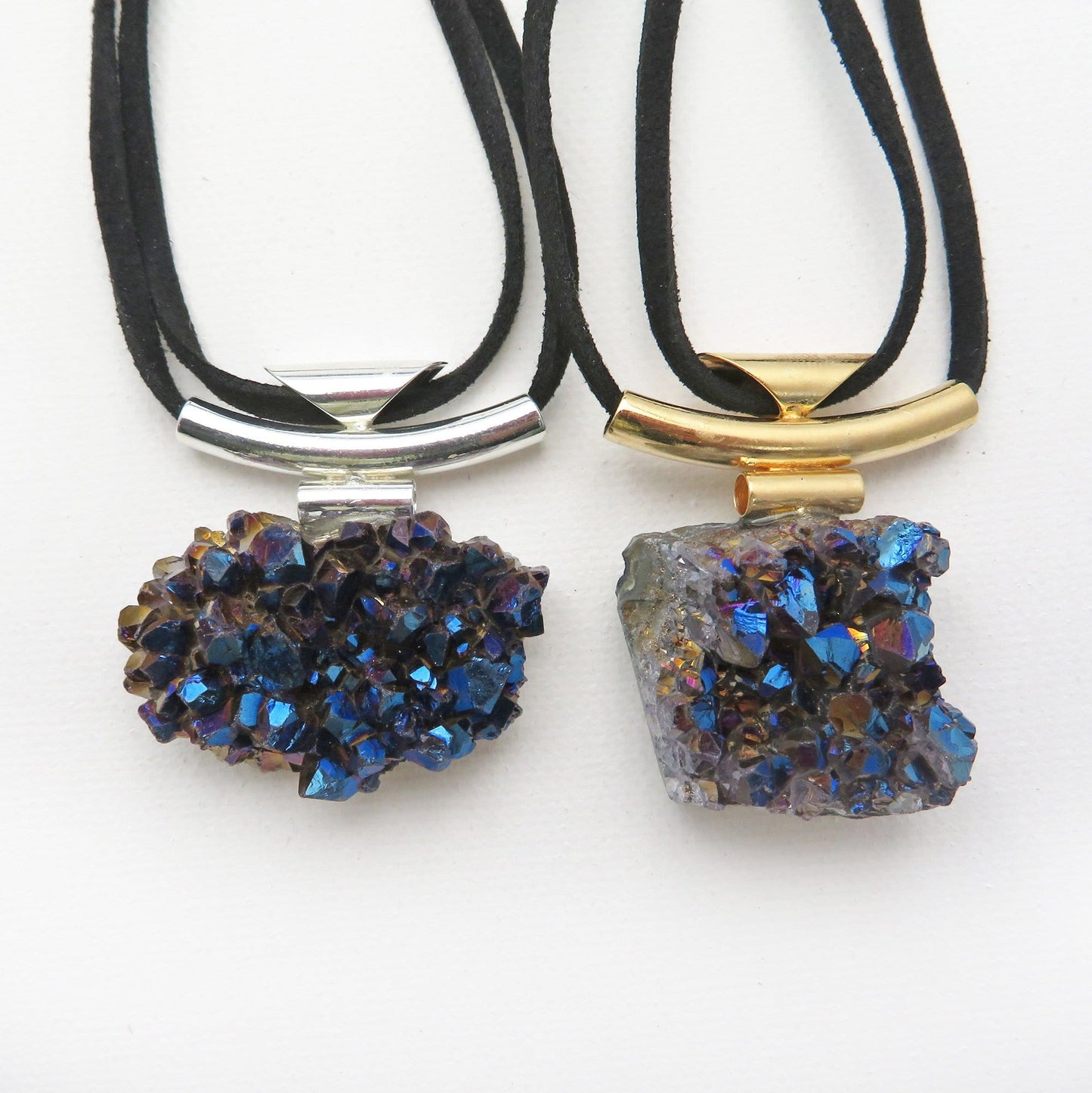 necklaces available in silver or gold with a mystic blue titanium finish