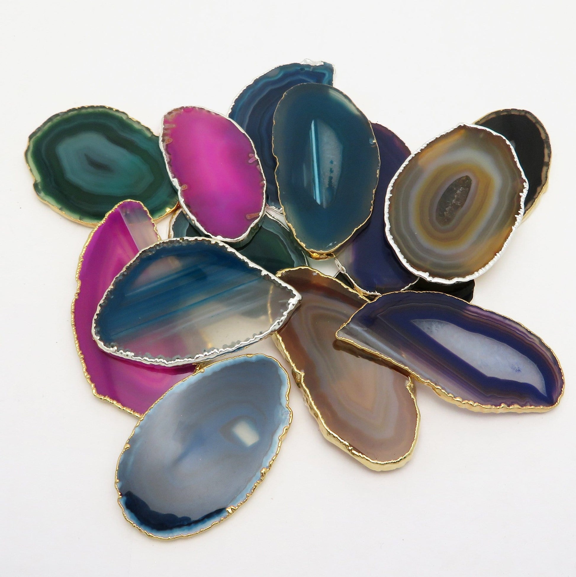 This picture is showing all the variety of colors we have available for our agate slices plated edge, on a white background.