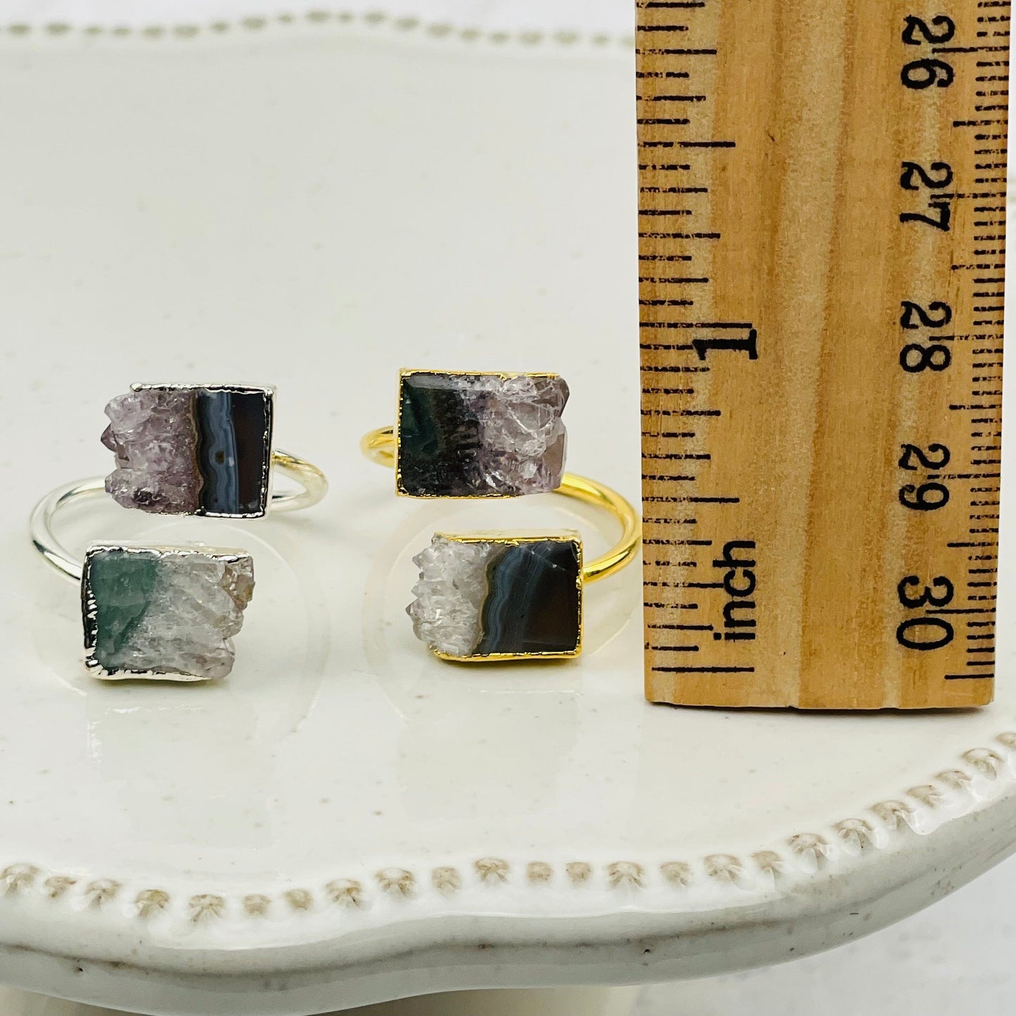 rings next to a ruler for size reference 