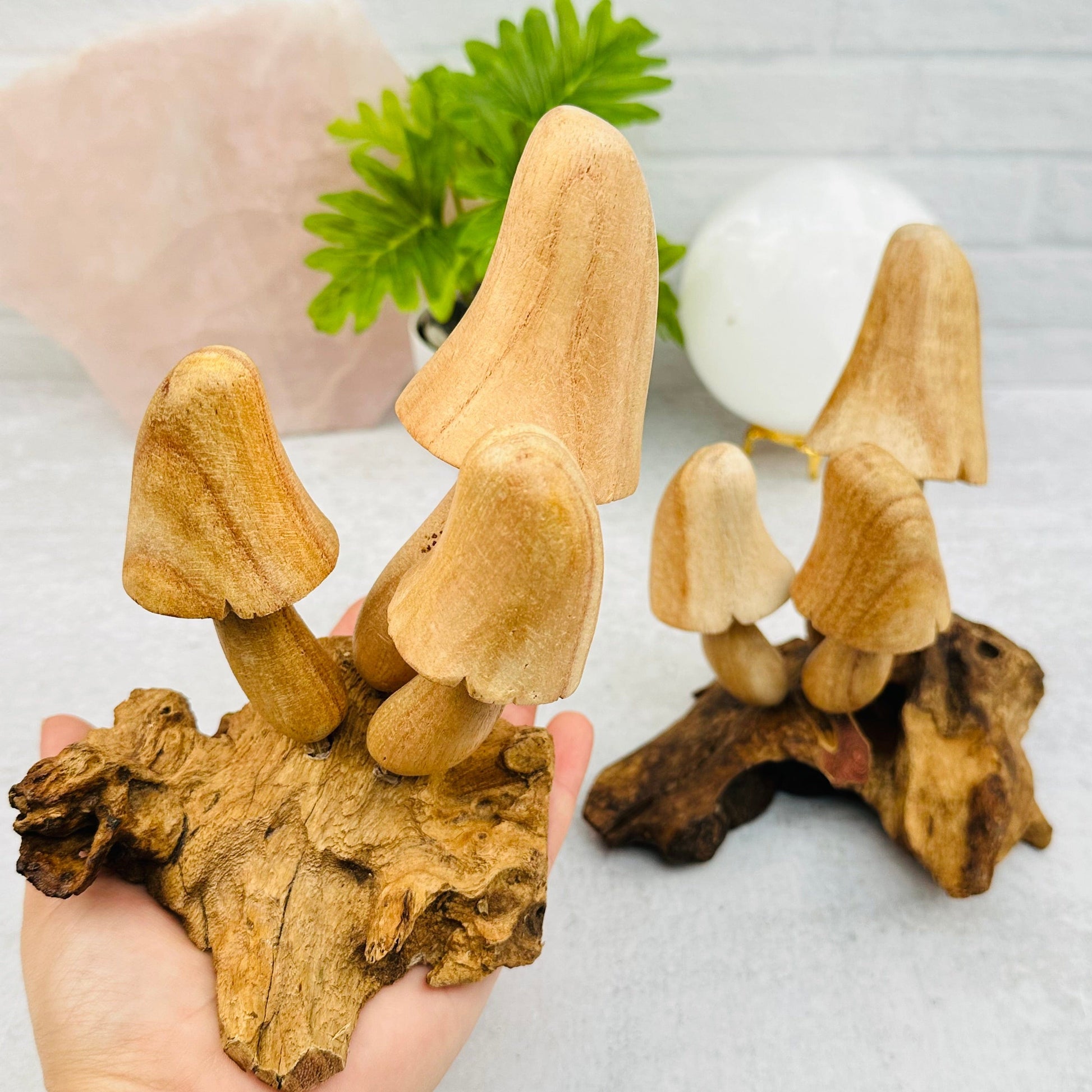 large wooden mushroom in hand for size reference 