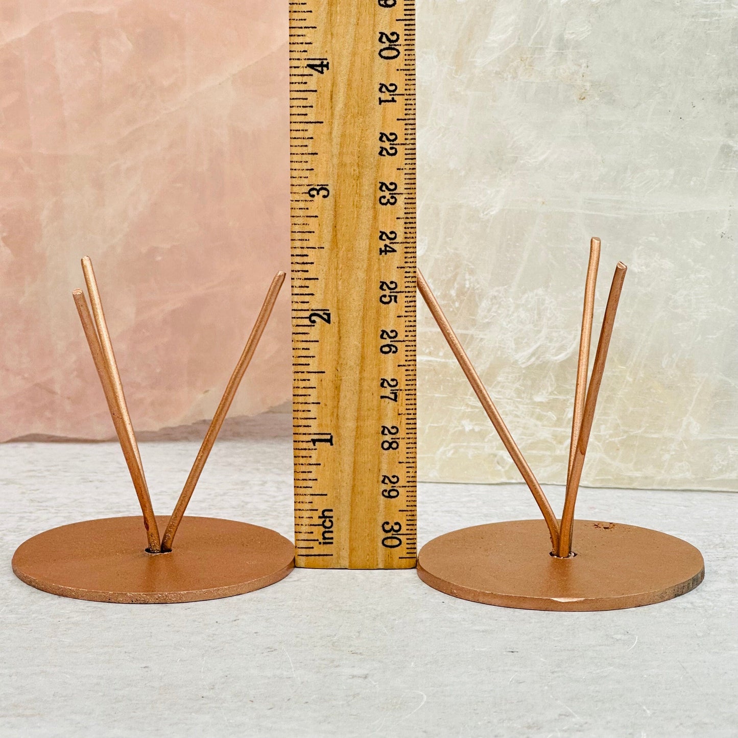 Metal Crystal Stands next to a ruler for size reference 