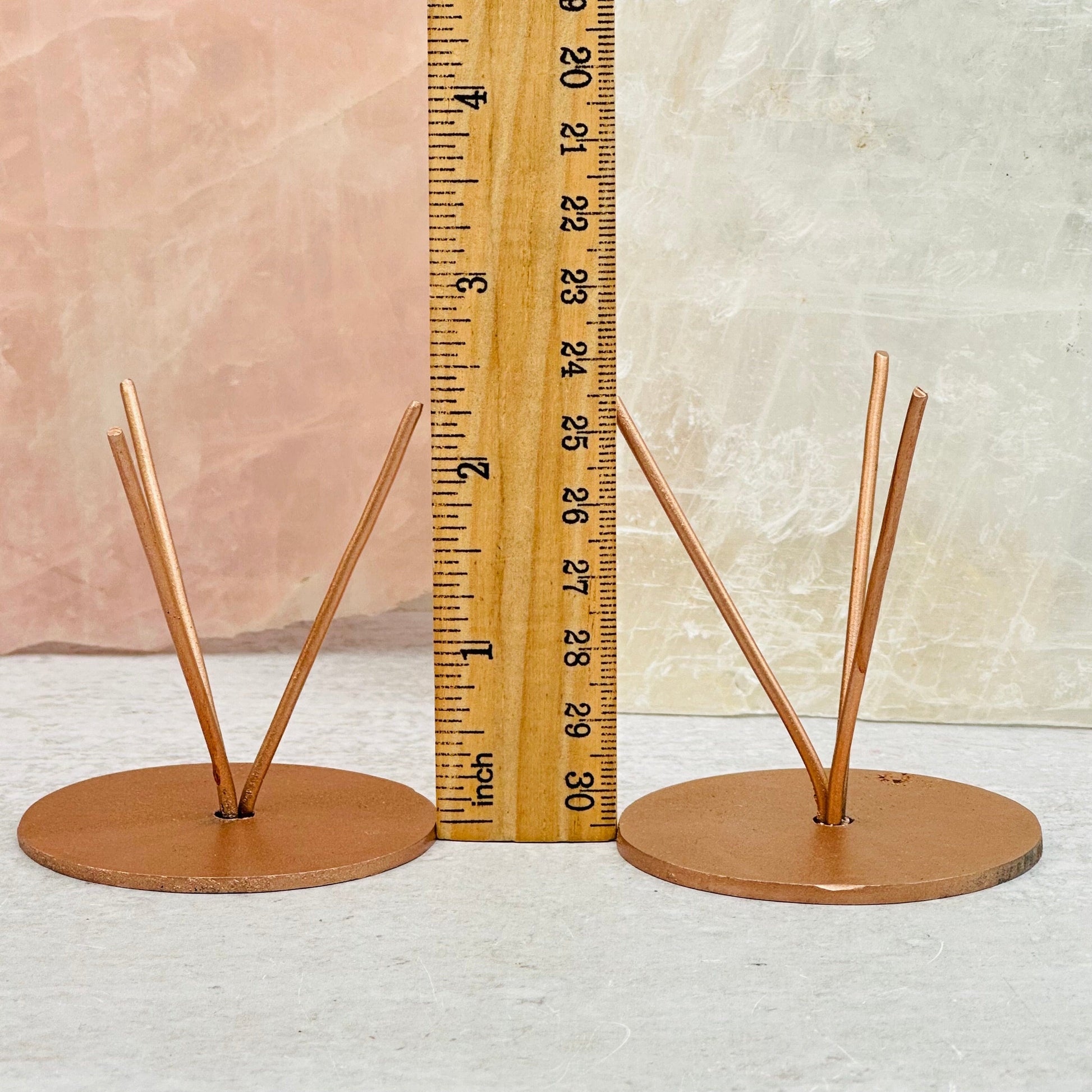 Metal Crystal Stands next to a ruler for size reference 