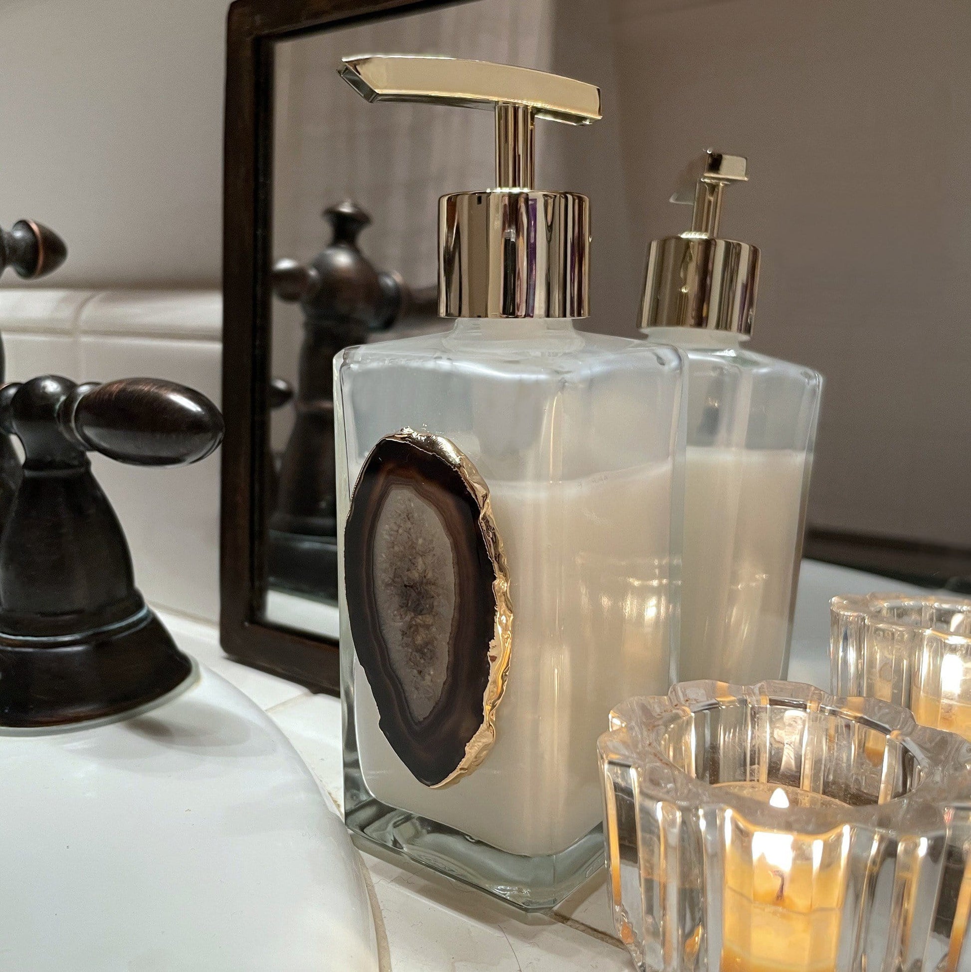 Picture of a black agate soap dispenser full of soap.