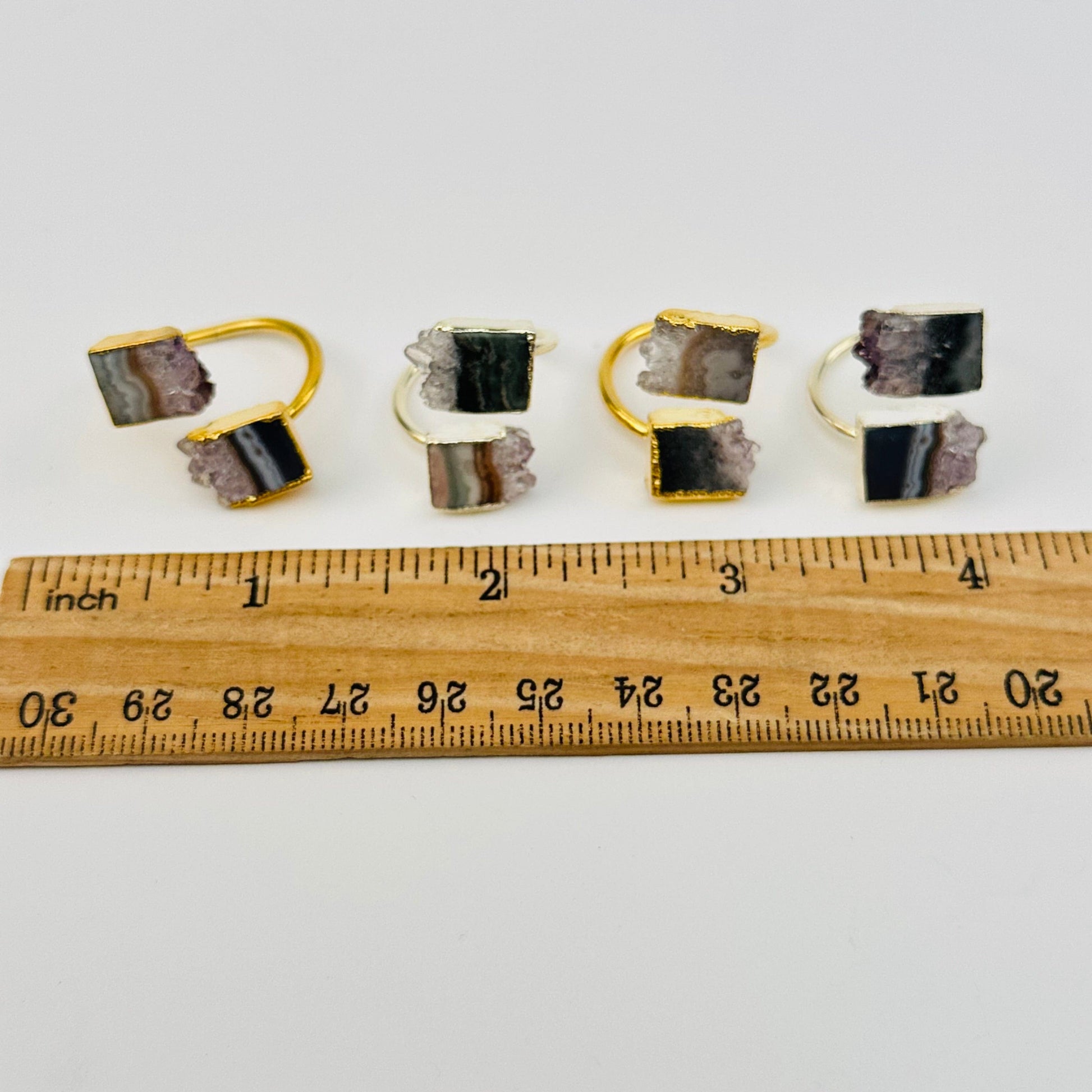 rings next to a ruler for size reference 