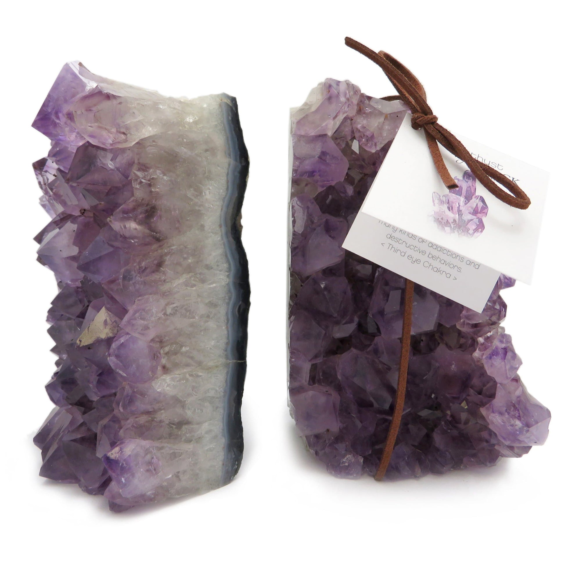 Side shot of amethyst book ends displayed on a white back ground.