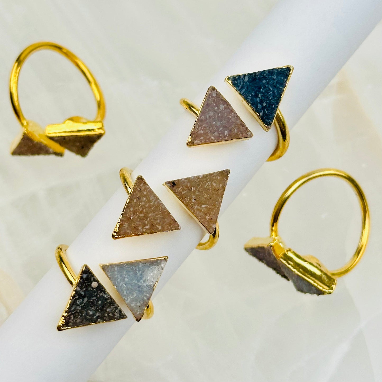 close up of the details on these druzy crystal rings 