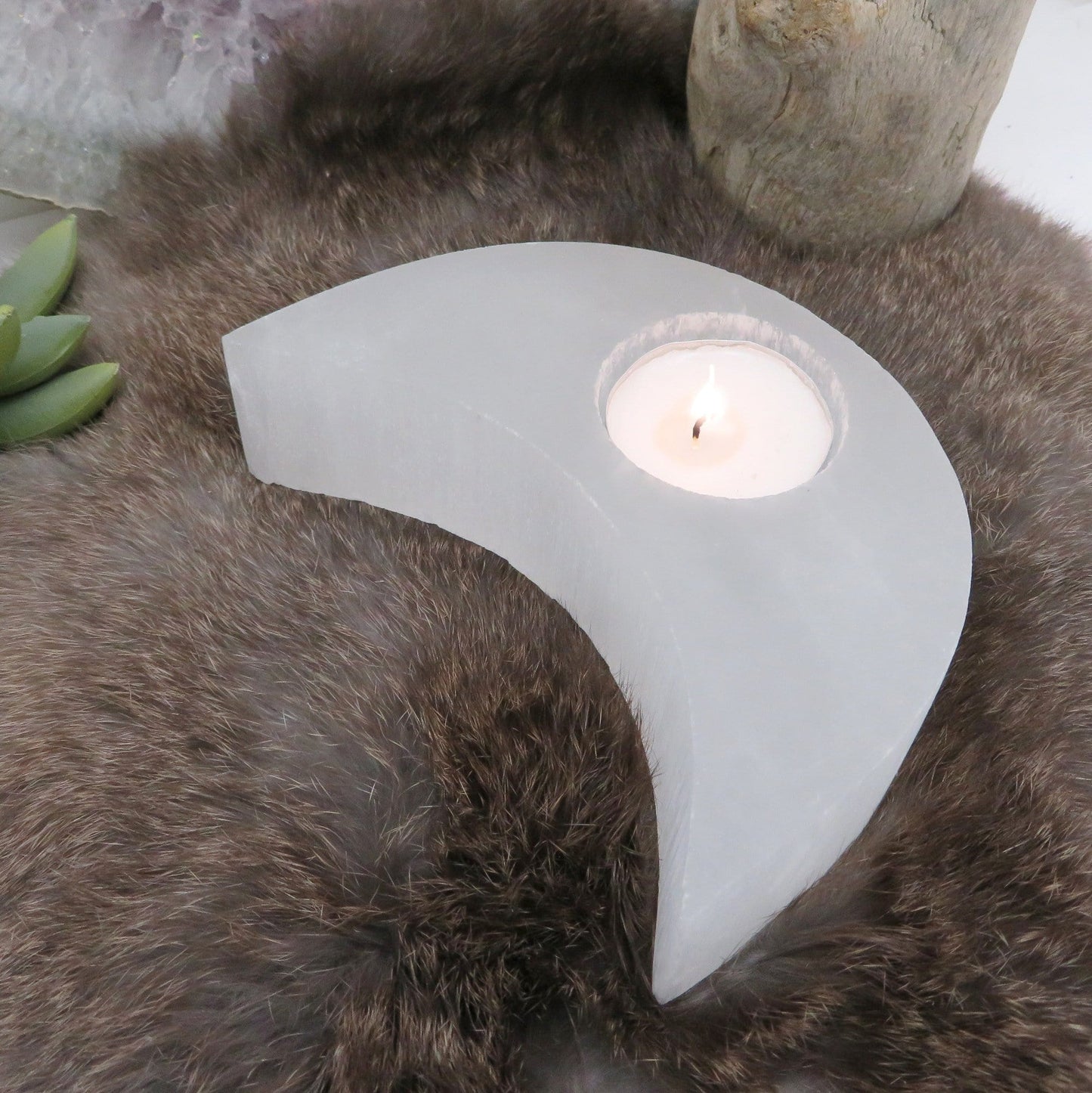 angled view of selenite crescent moon candle holder