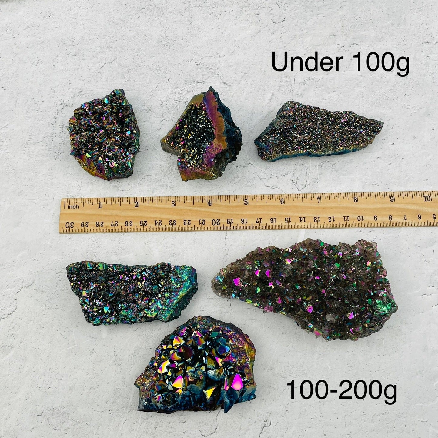 Amethyst Druzy Cluster with Rainbow Titanium Finish next to a ruler for size reference. sold by weight 