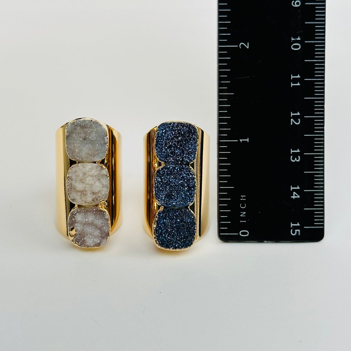rings next to a ruler for size reference 
