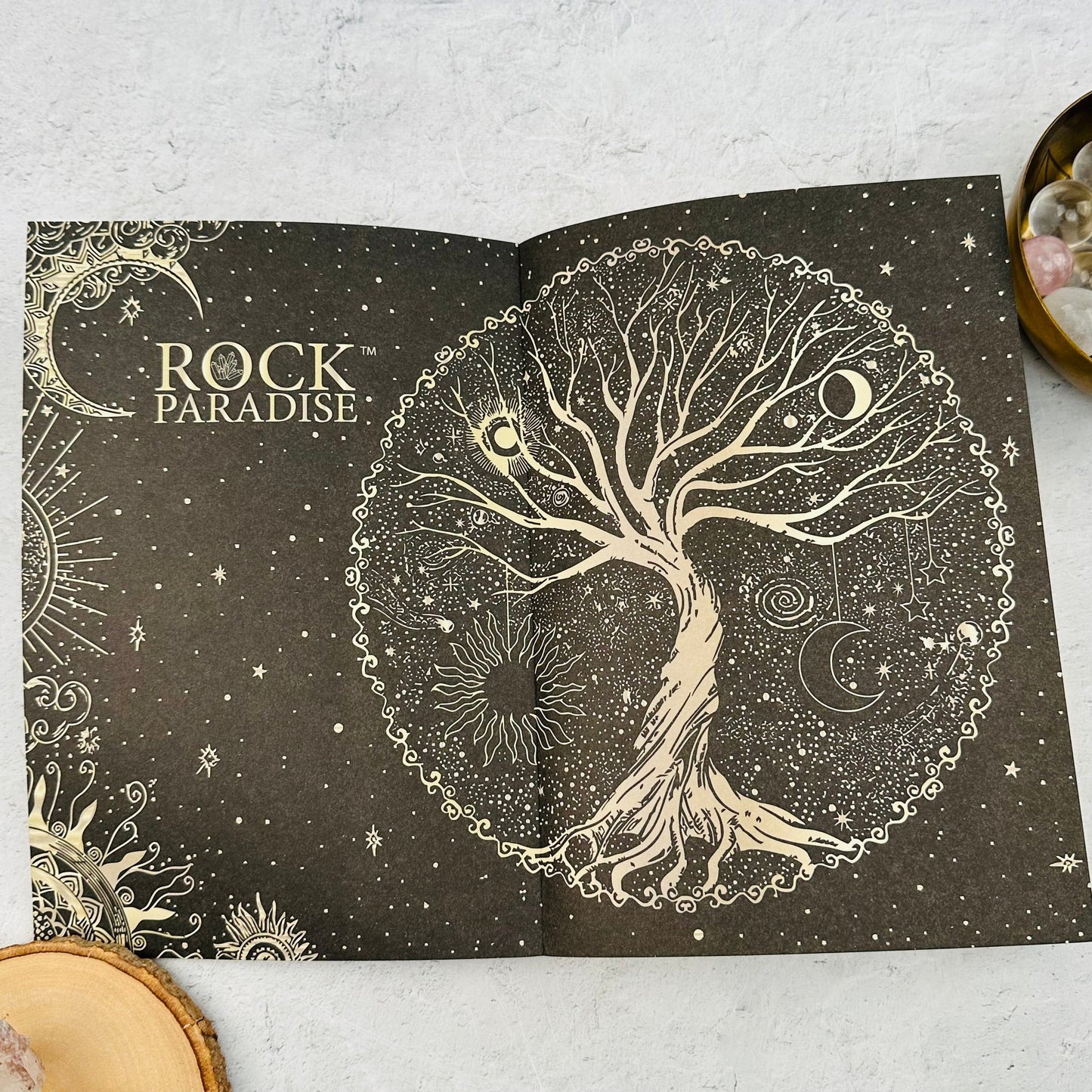 first page of the book has tree of life art 