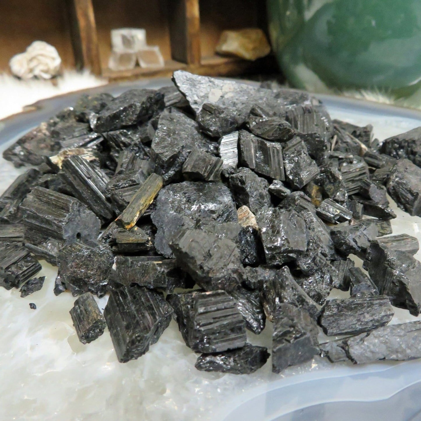 a pile of tourmaline chips displayed to show different textures and thickness reference