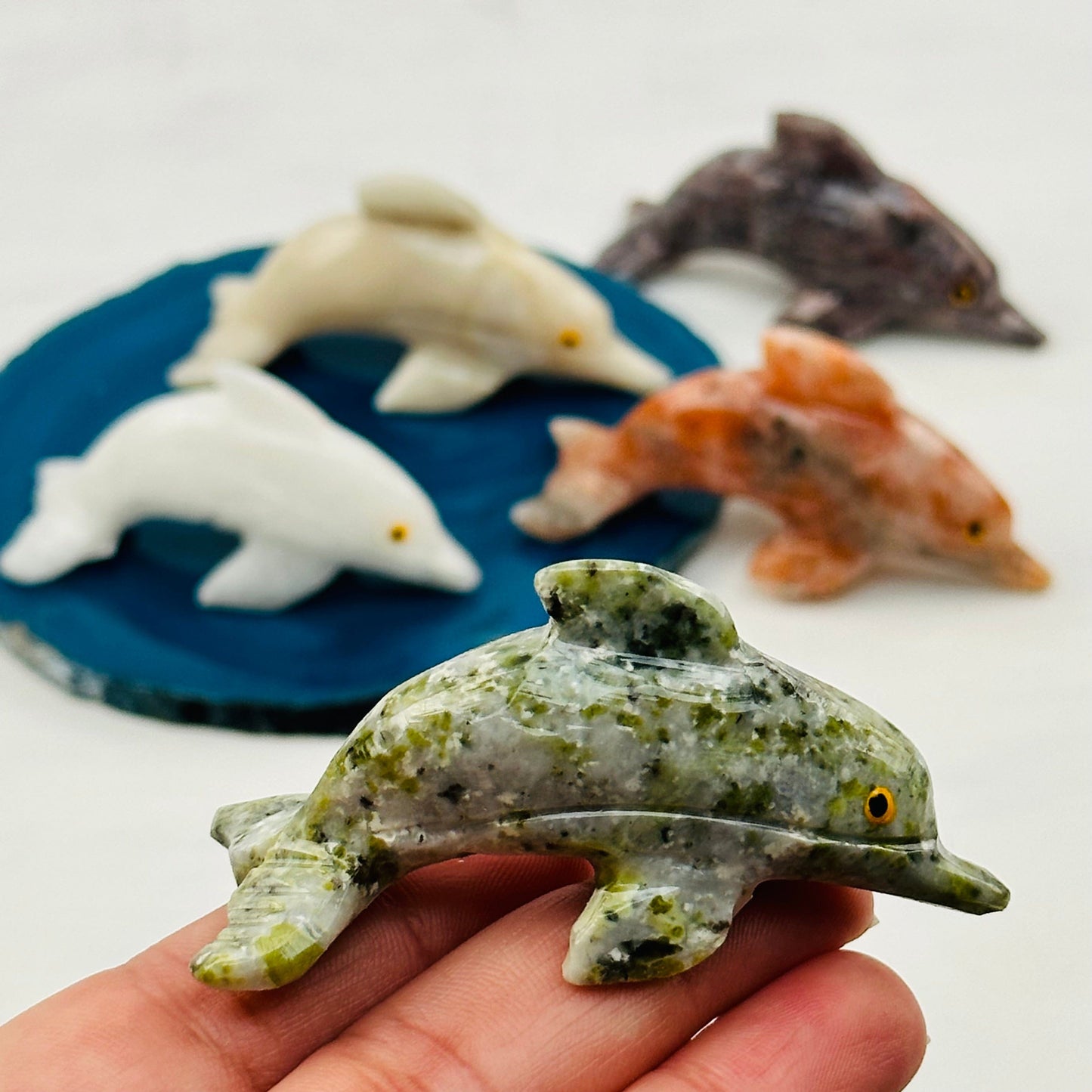 Carved Crystal Dolphin in hand for size reference 