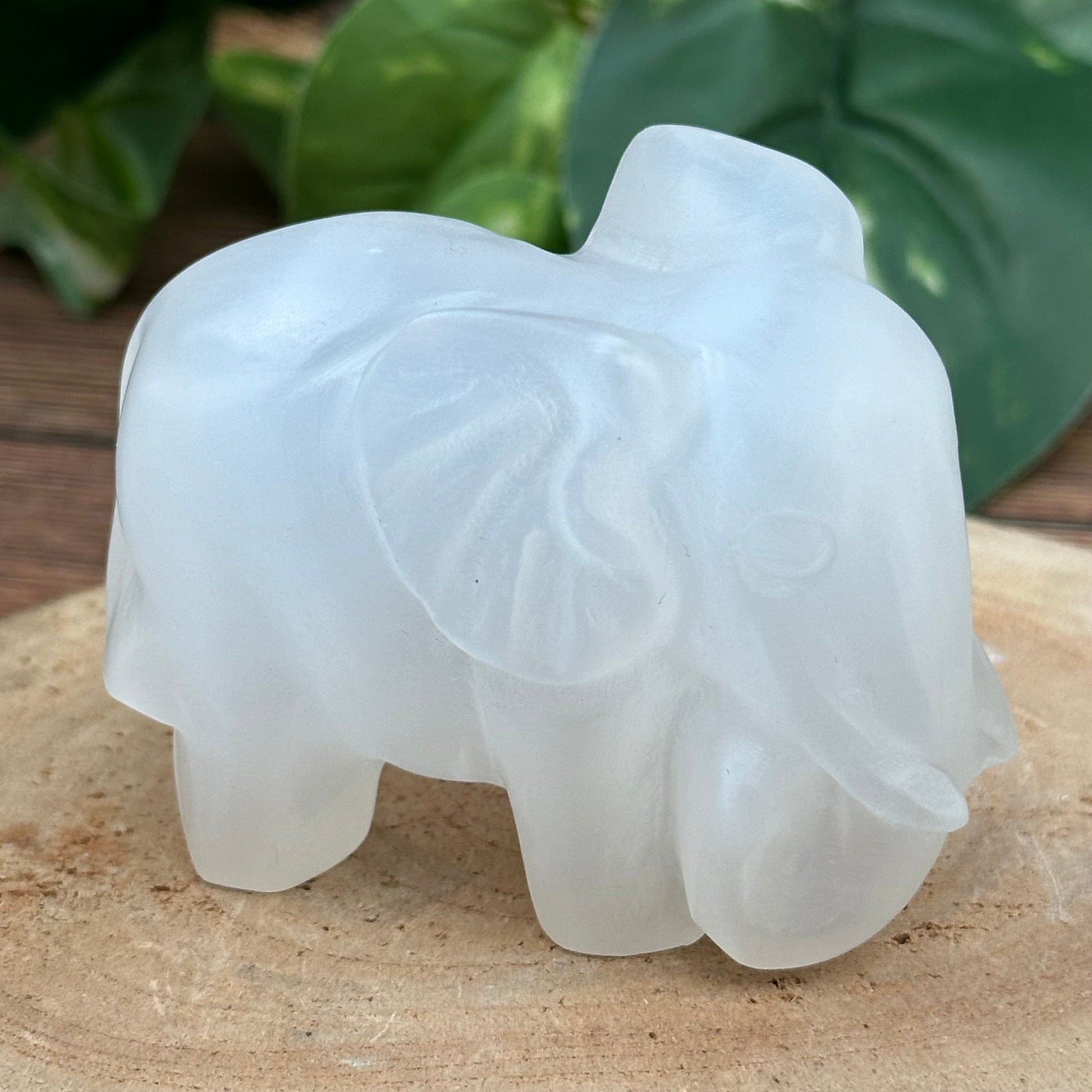 close up of the engraved details on this selenite elephant  