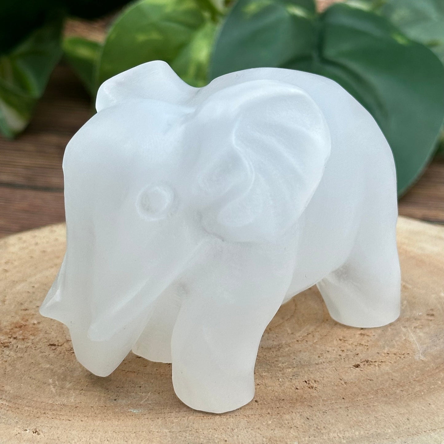 close up of the engraved details on this selenite elephant  