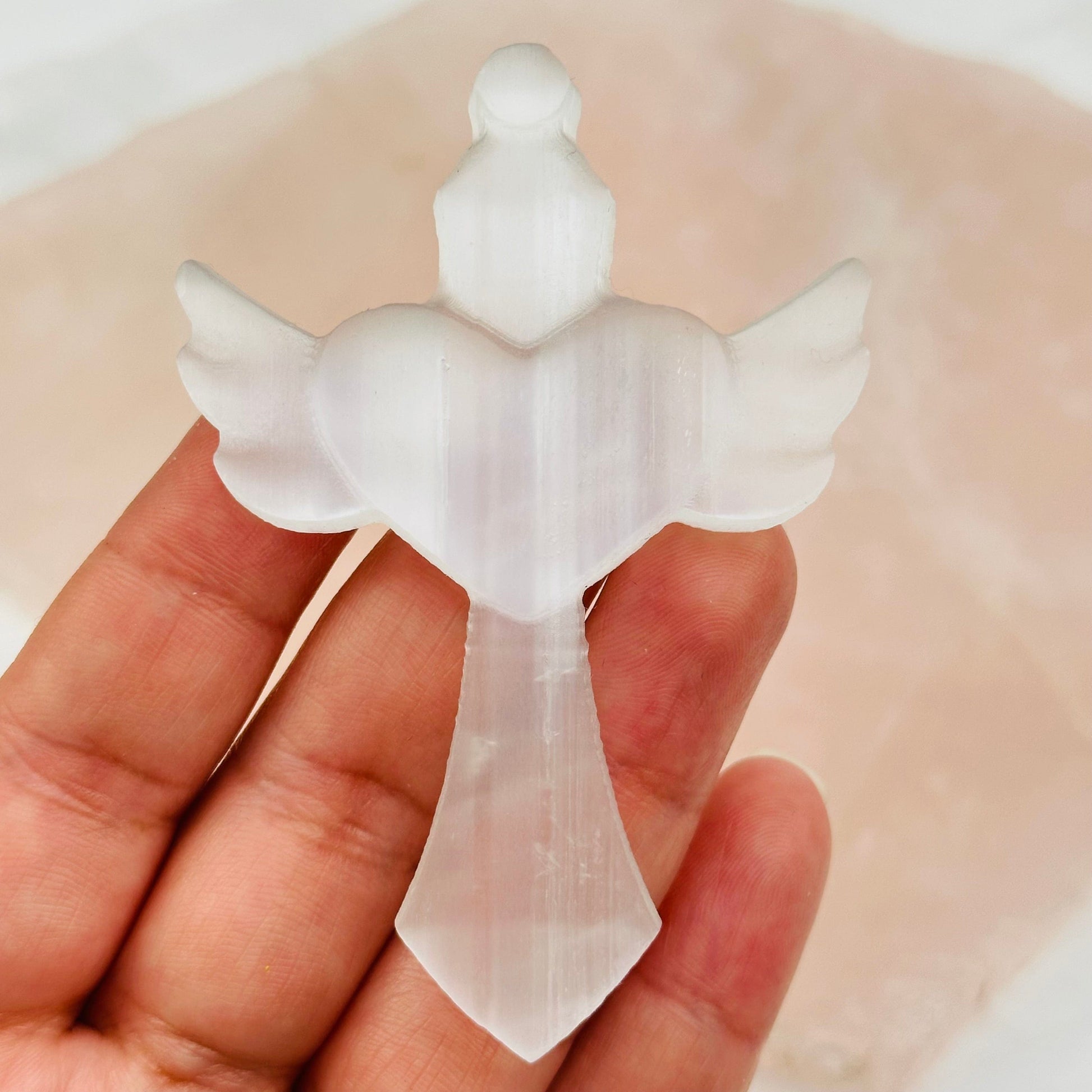 close up of the details on this selenite cross 