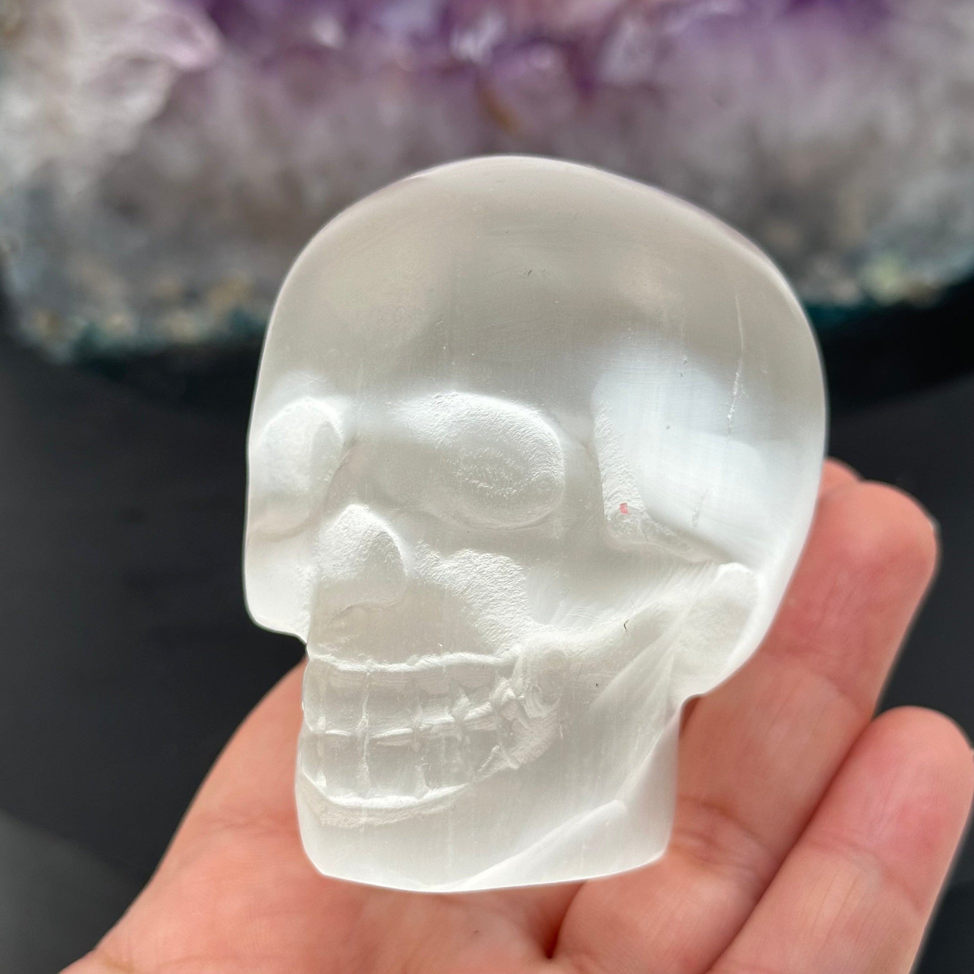 crystal skull in hand for size reference 