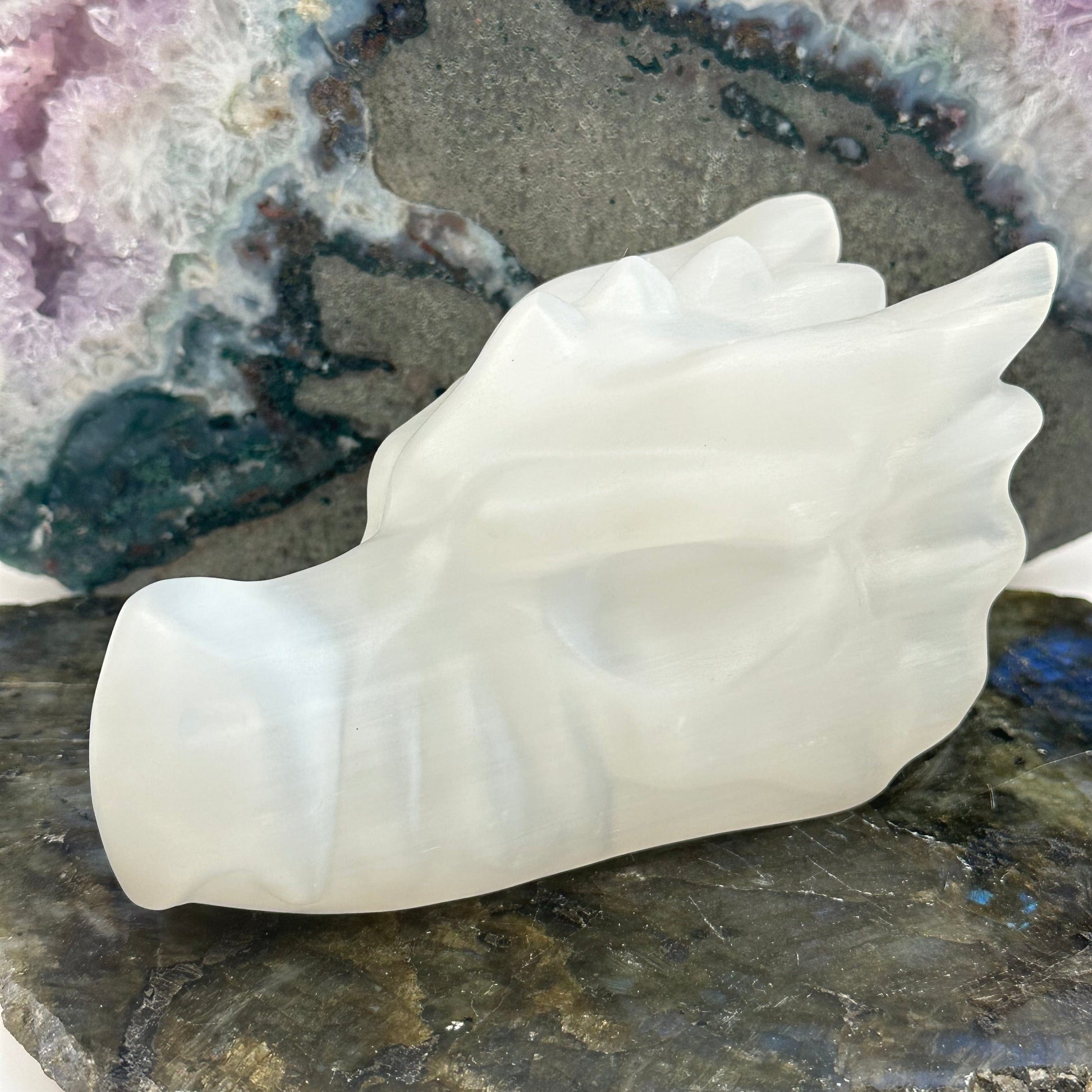 selenite crystal dragon head displayed as home decor