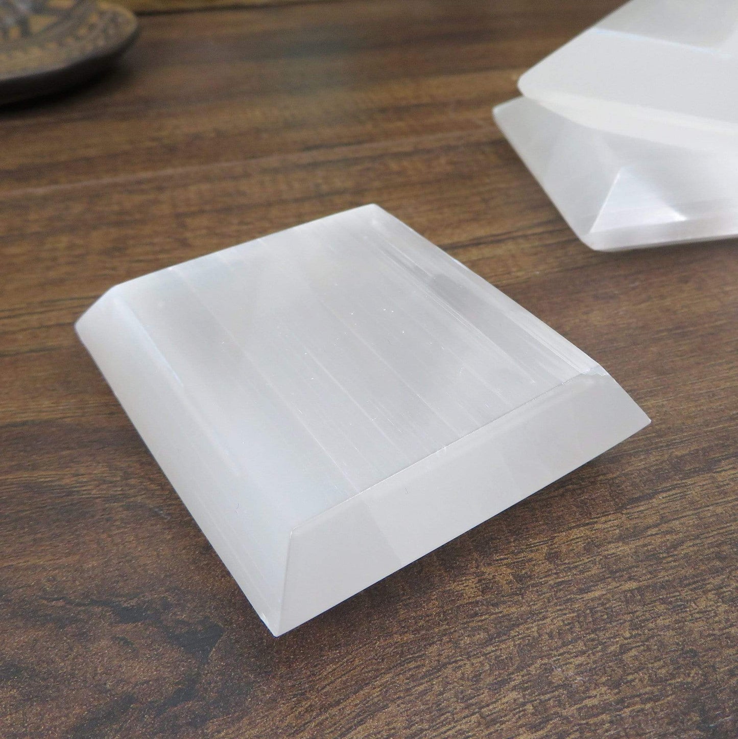 close up of selenite square charging plate for details