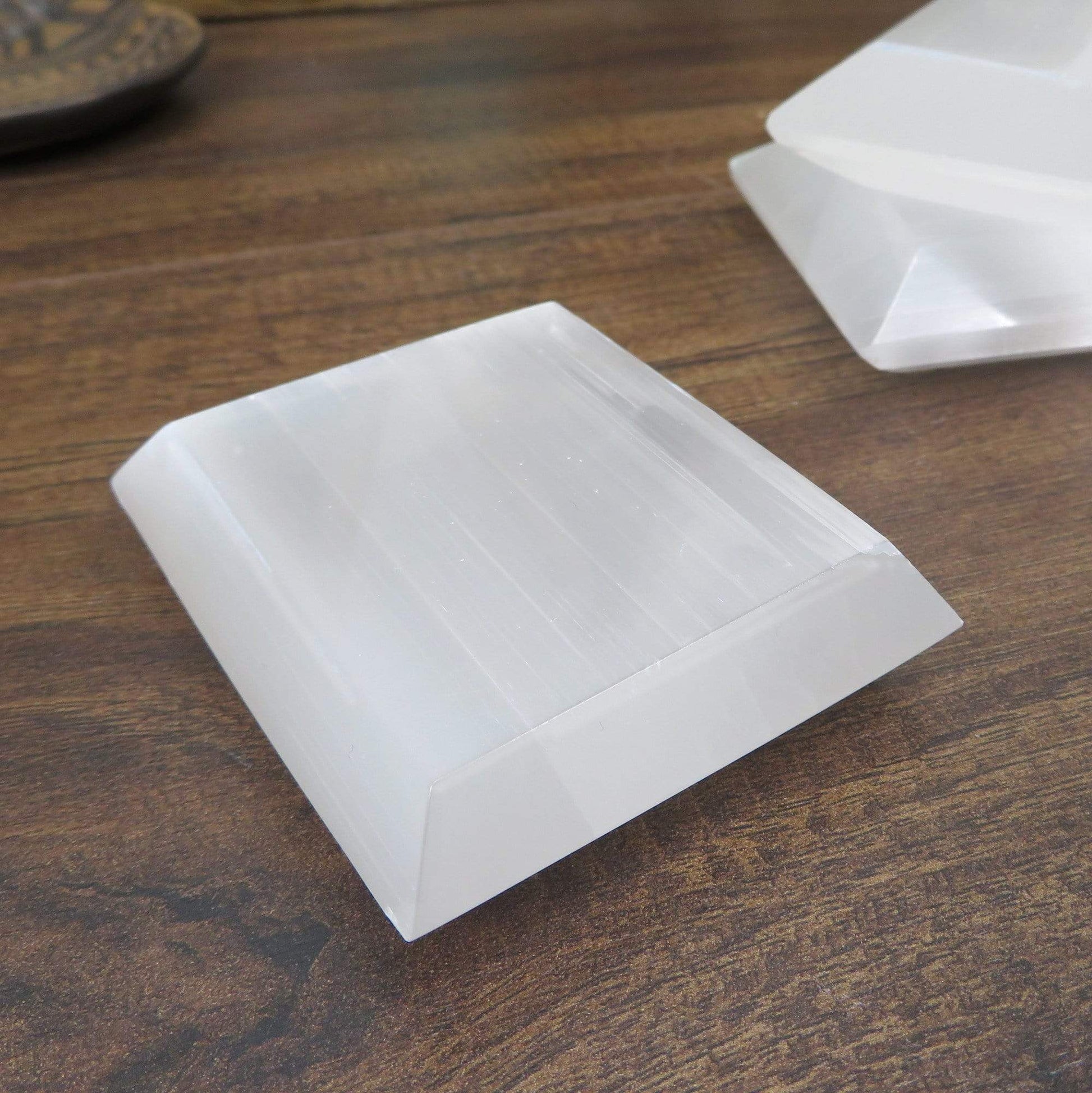 close up of selenite square charging plate for details