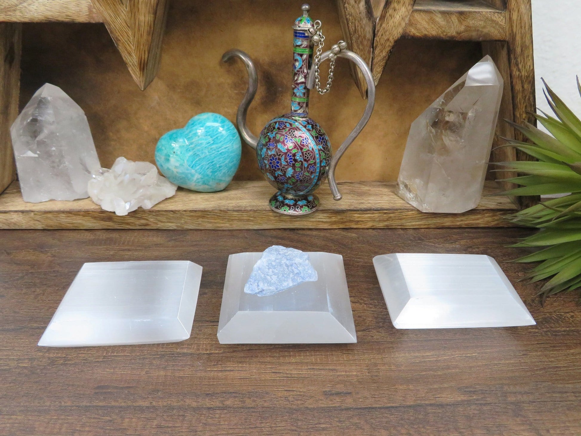angled view of selenite square charging plates on display for thickness