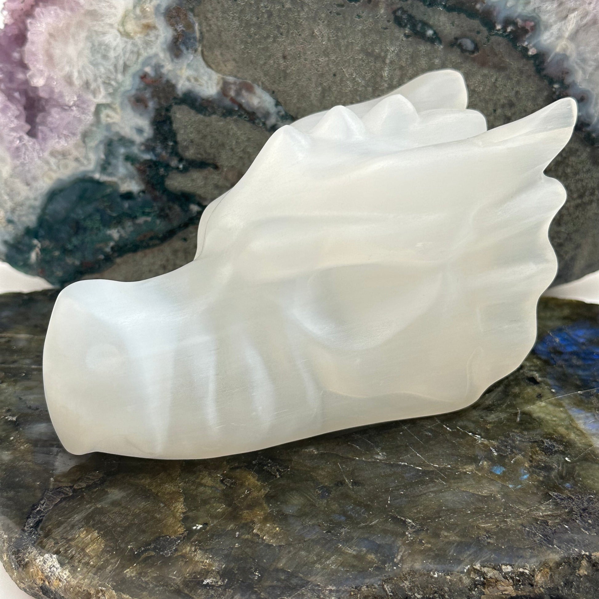 selenite crystal dragon head displayed as home decor