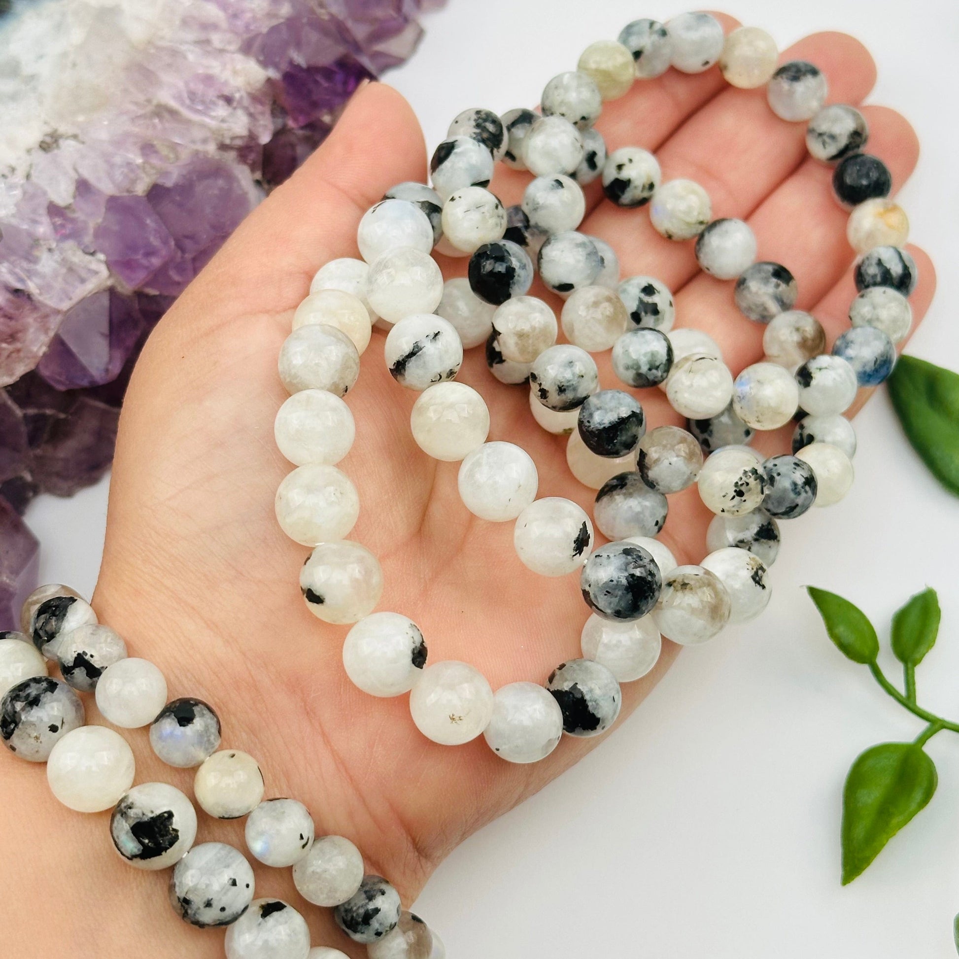 high quality moonstone bracelets displayed on hand for size reference 