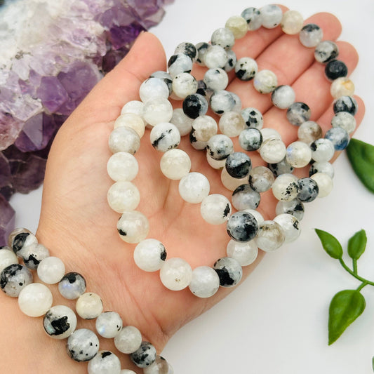 high quality moonstone bracelets displayed on hand for size reference 