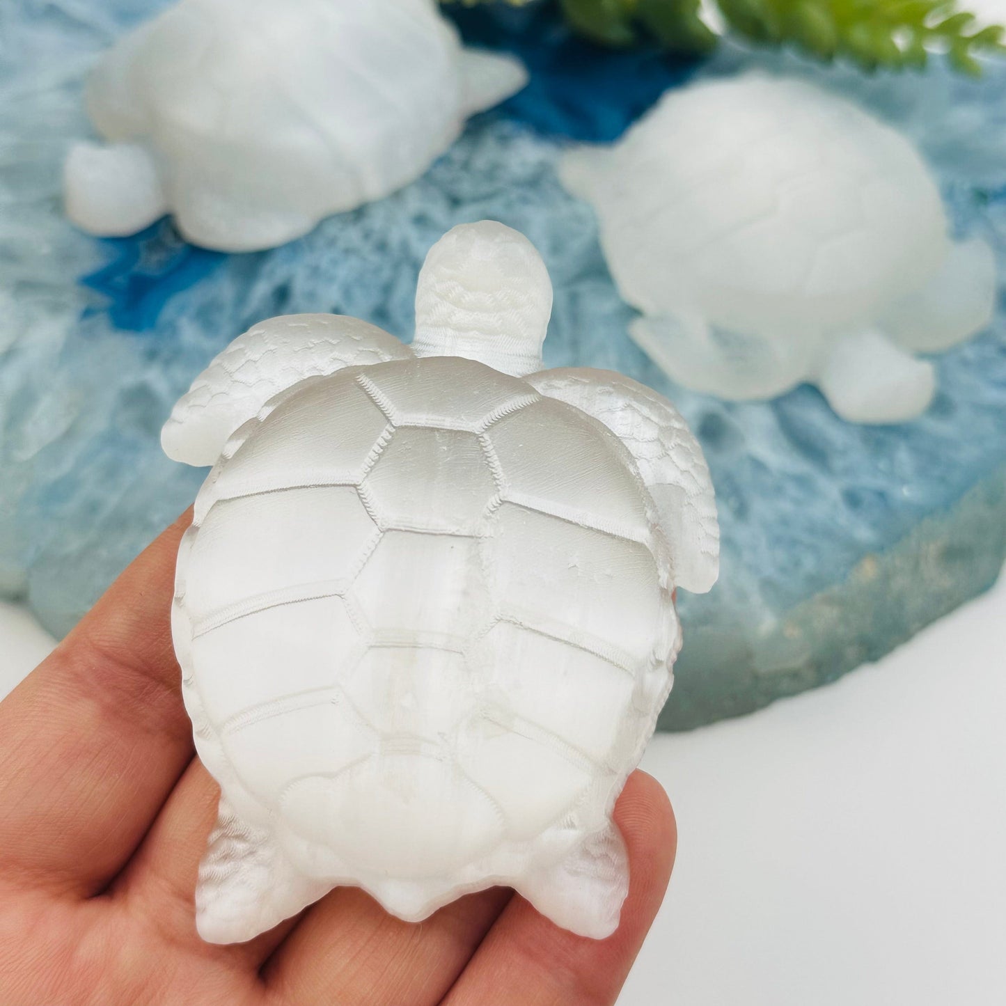 close up of the engraved details on this selenite crystal turtle