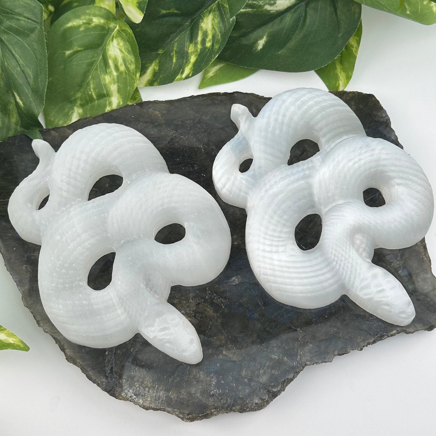 selenite crystal snakes displayed as home decor 
