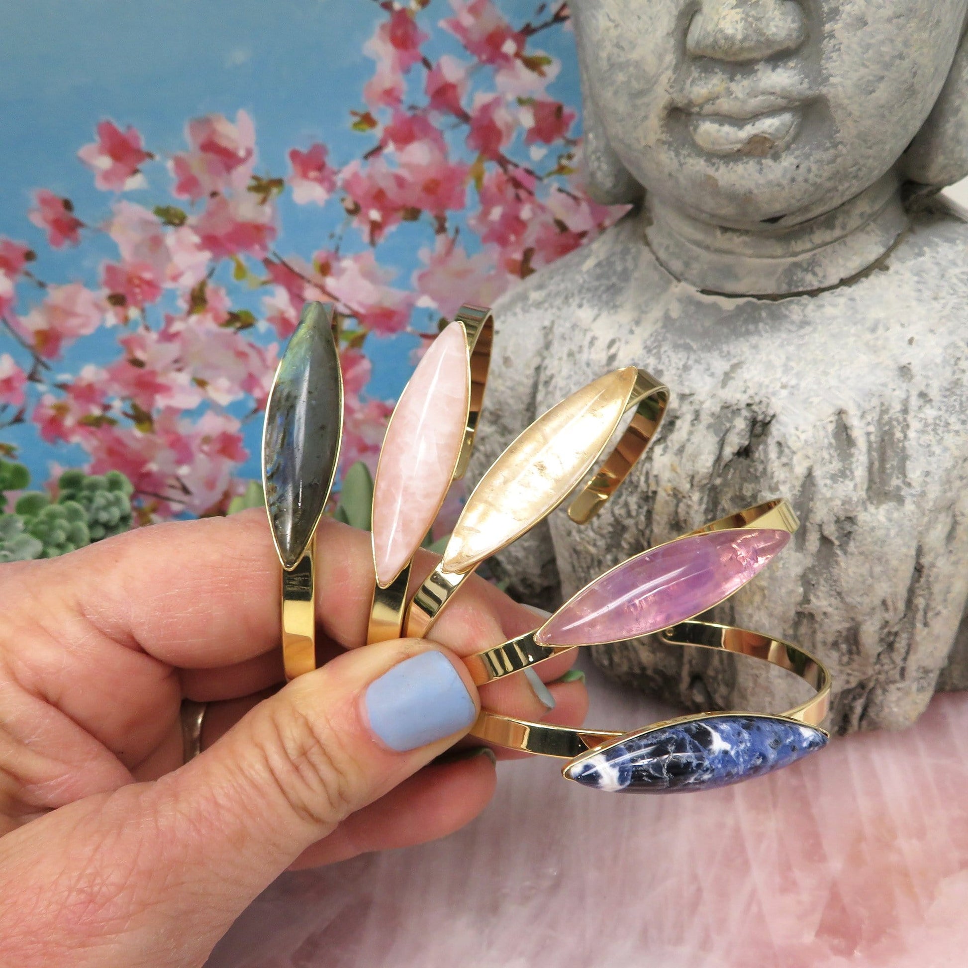 marquise stone bracelets in a hand