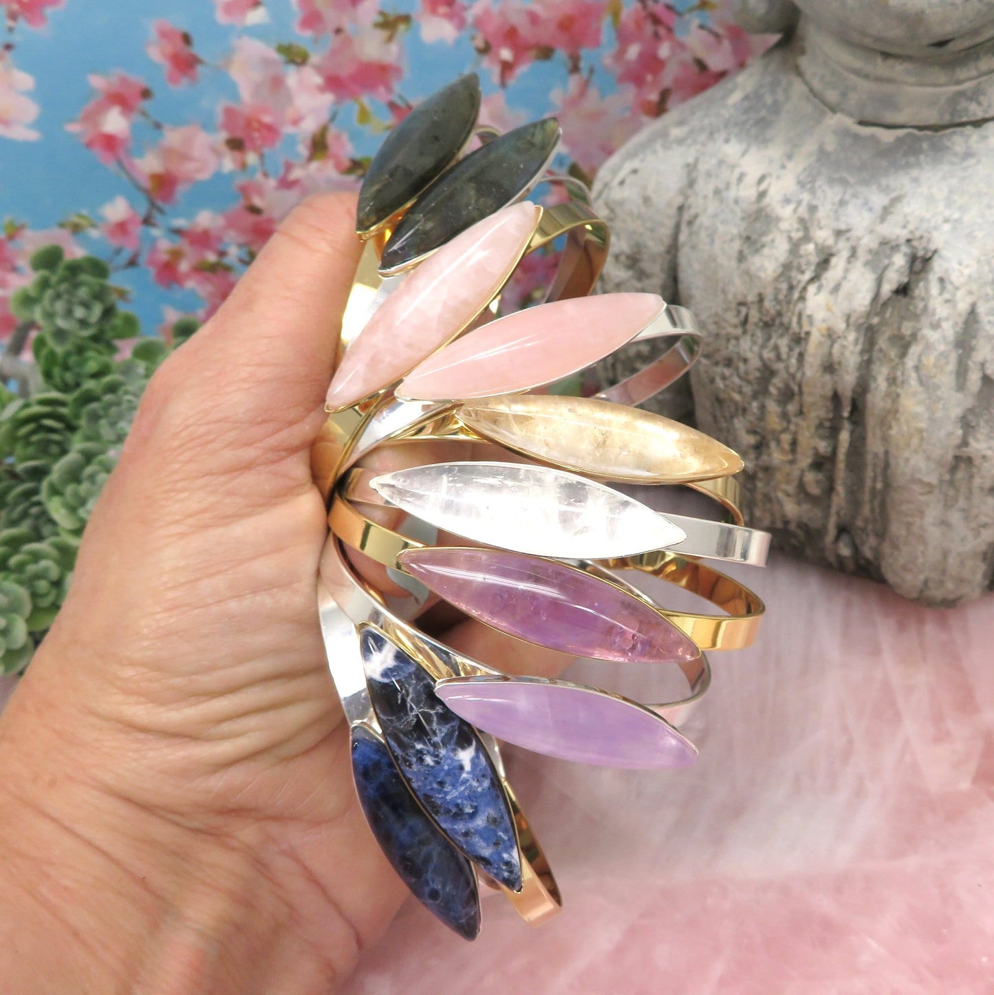a bunch of bracelets in a hand
