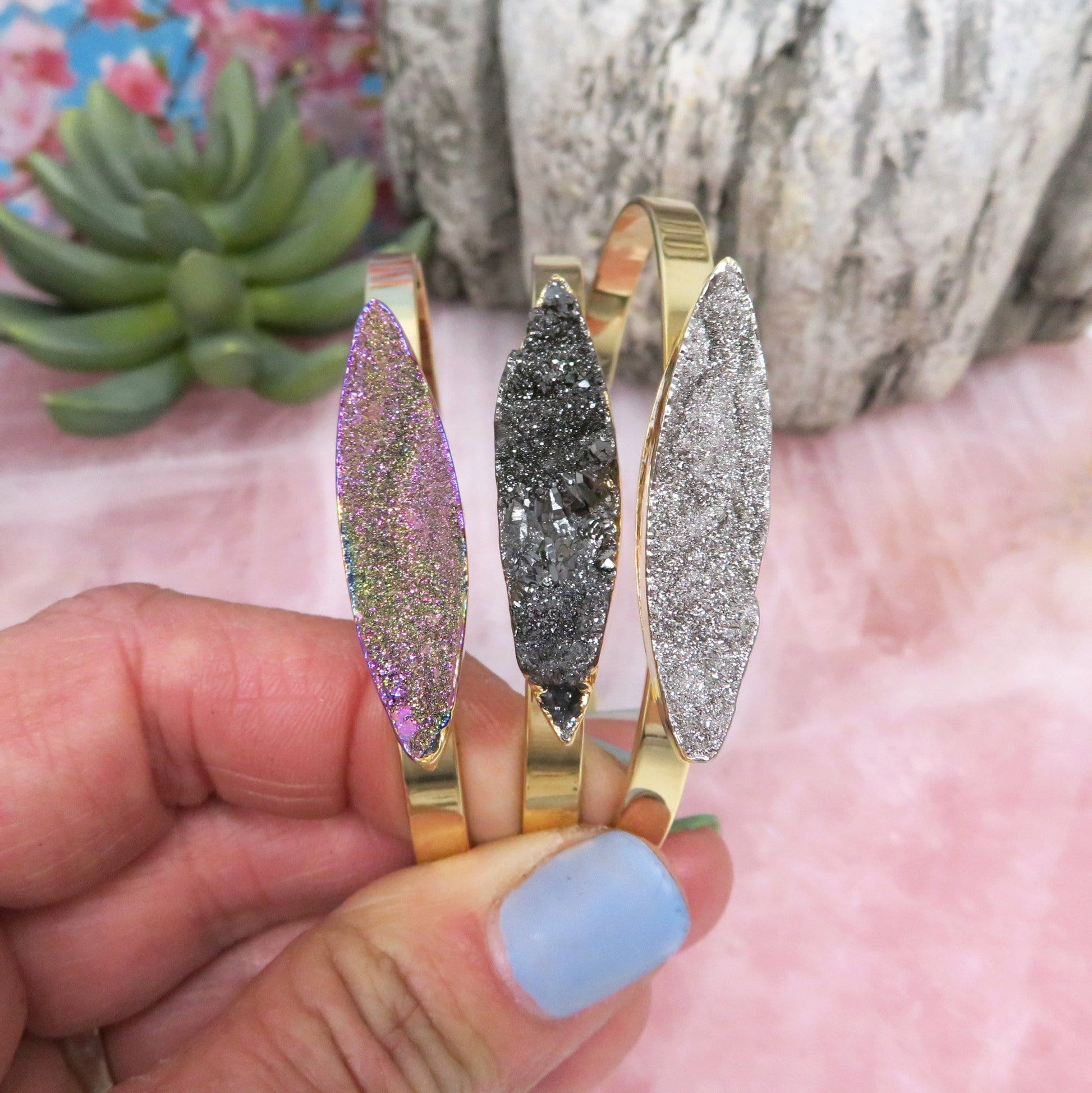 Titanium Druzy Stone Bracelets in a hand