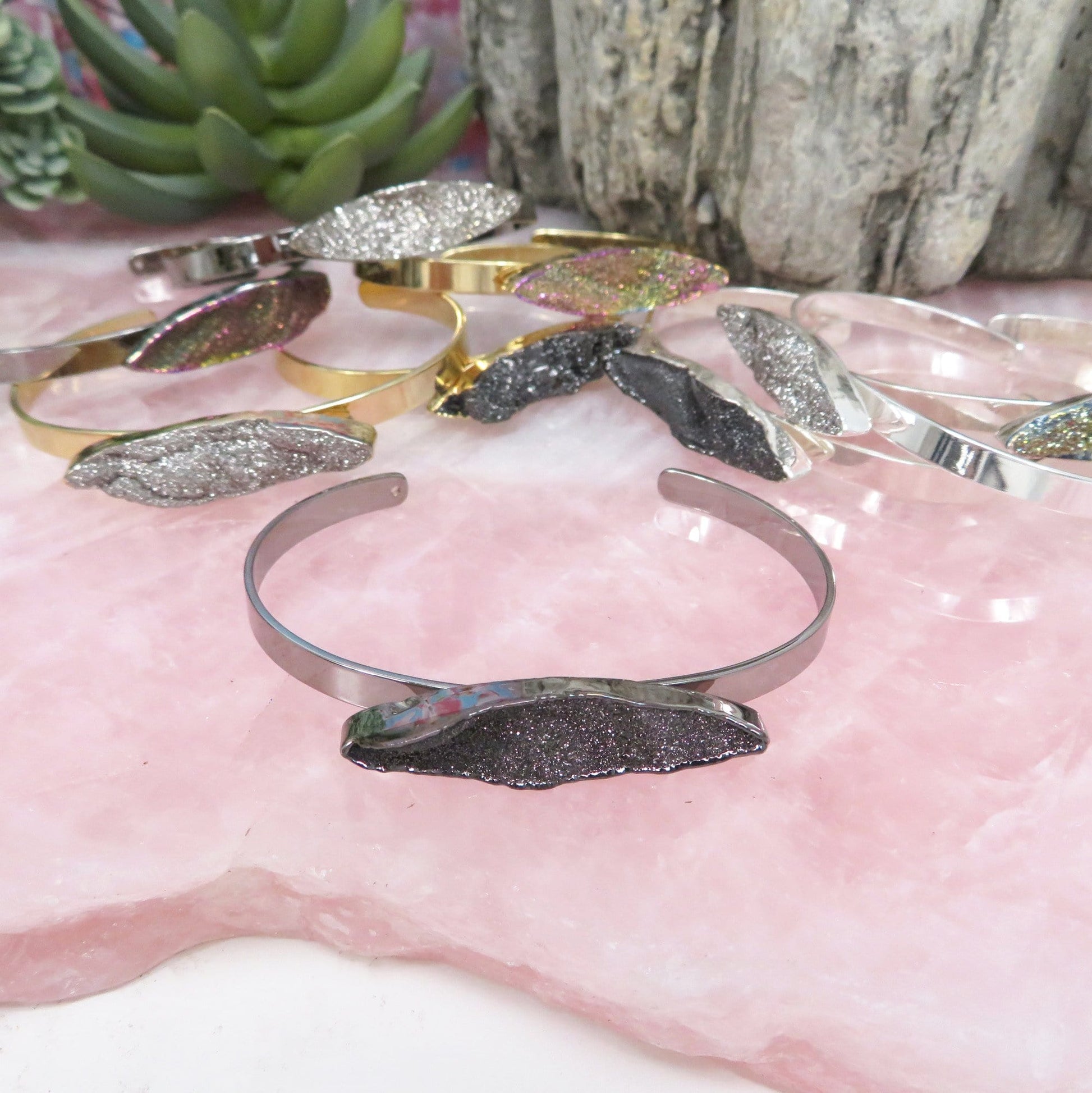Titanium Druzy Stone Bracelets on a stone platter