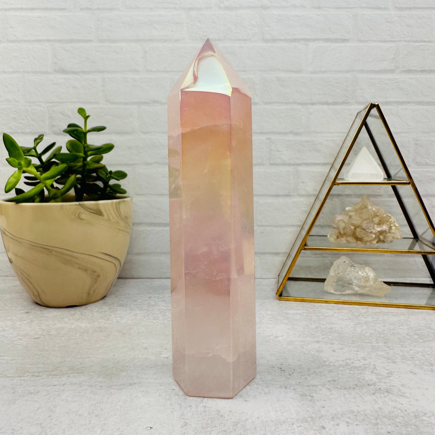 Angel Aura Rose Quartz Polished Tower displayed as home decor 