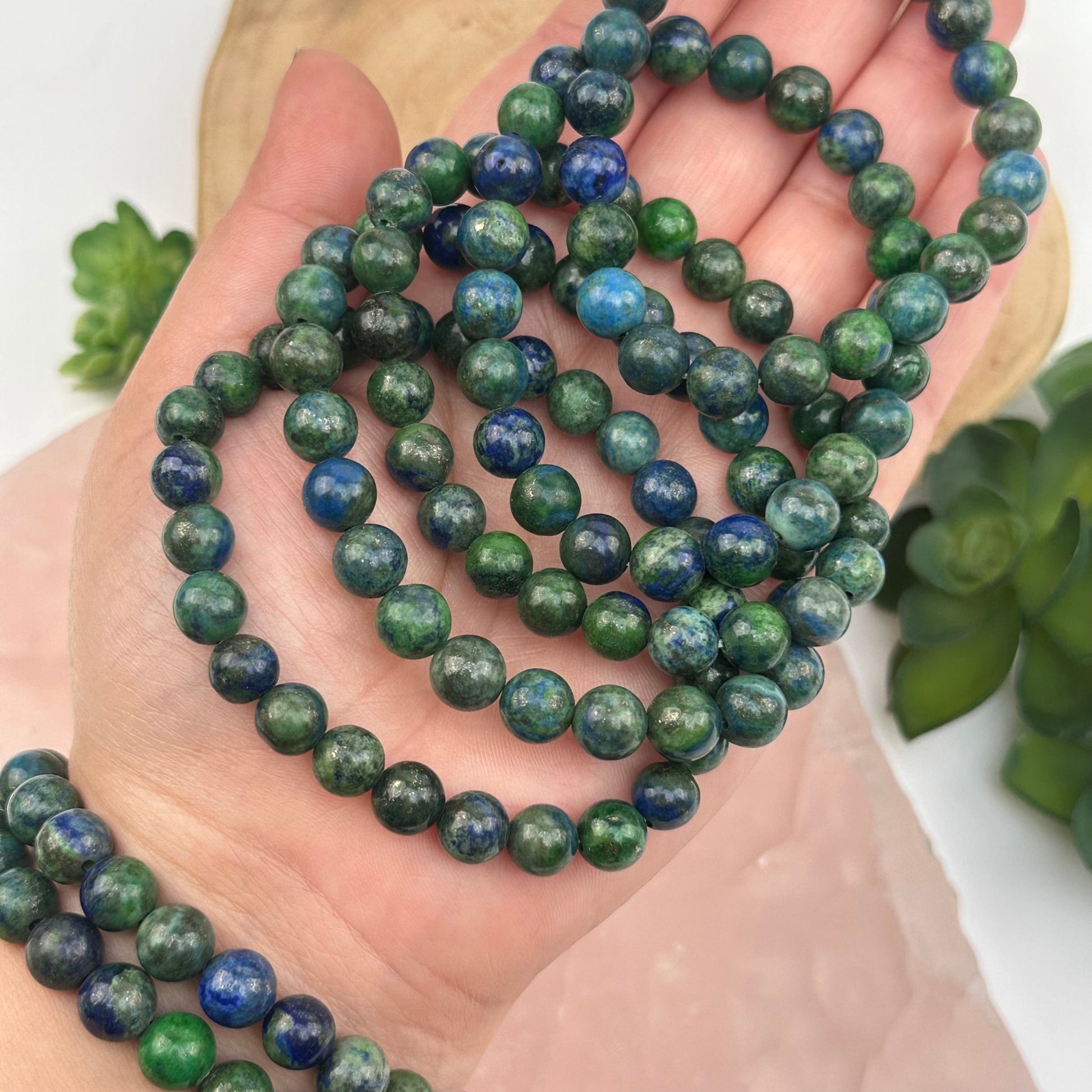 mala crystals bracelets on hand for size reference 
